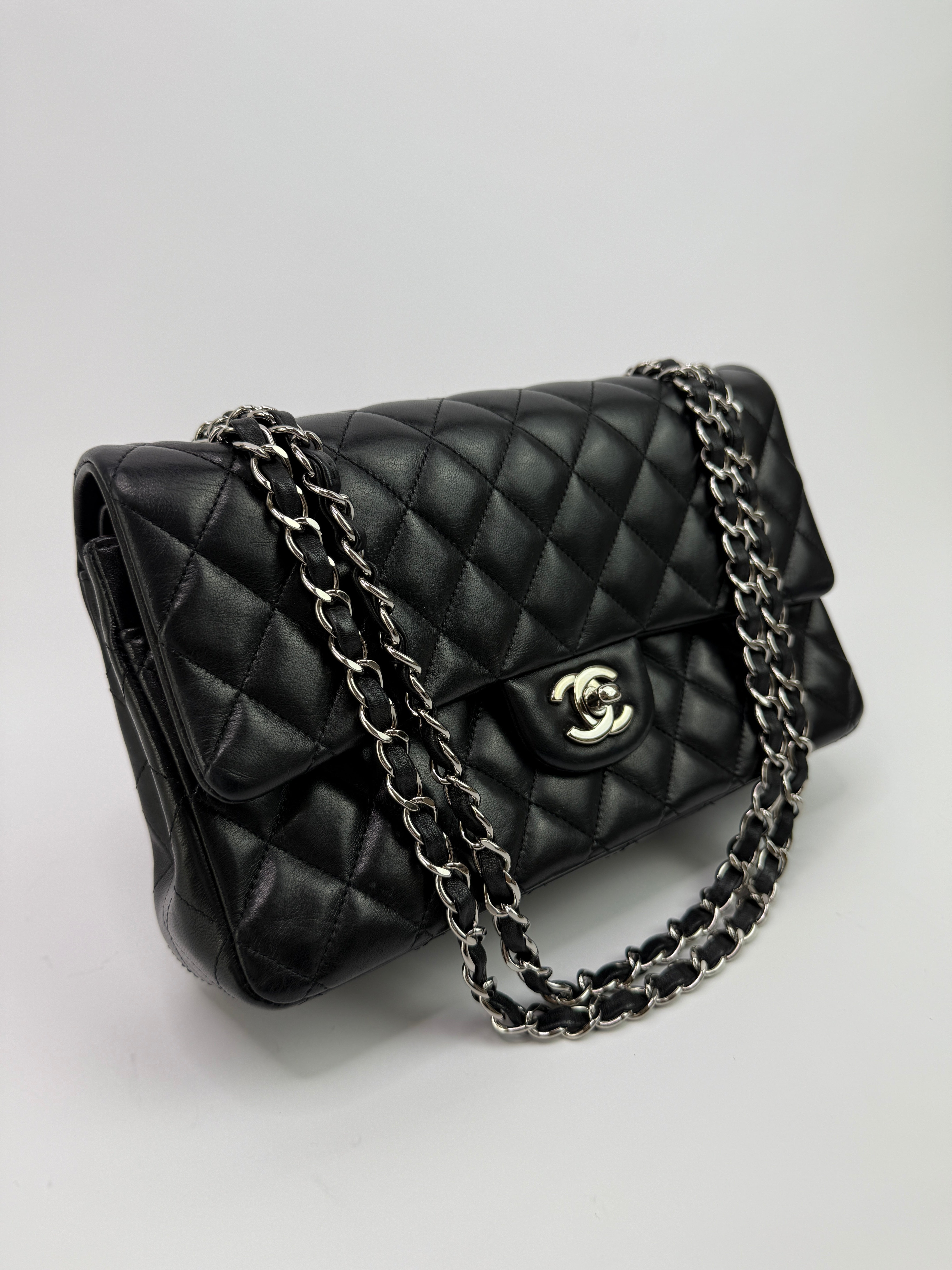 Authentic and preloved Chanel Medium Classic Double Flap Black Lambskin With Silver hardware Excellent condition. 100% Authenticity guarantee 