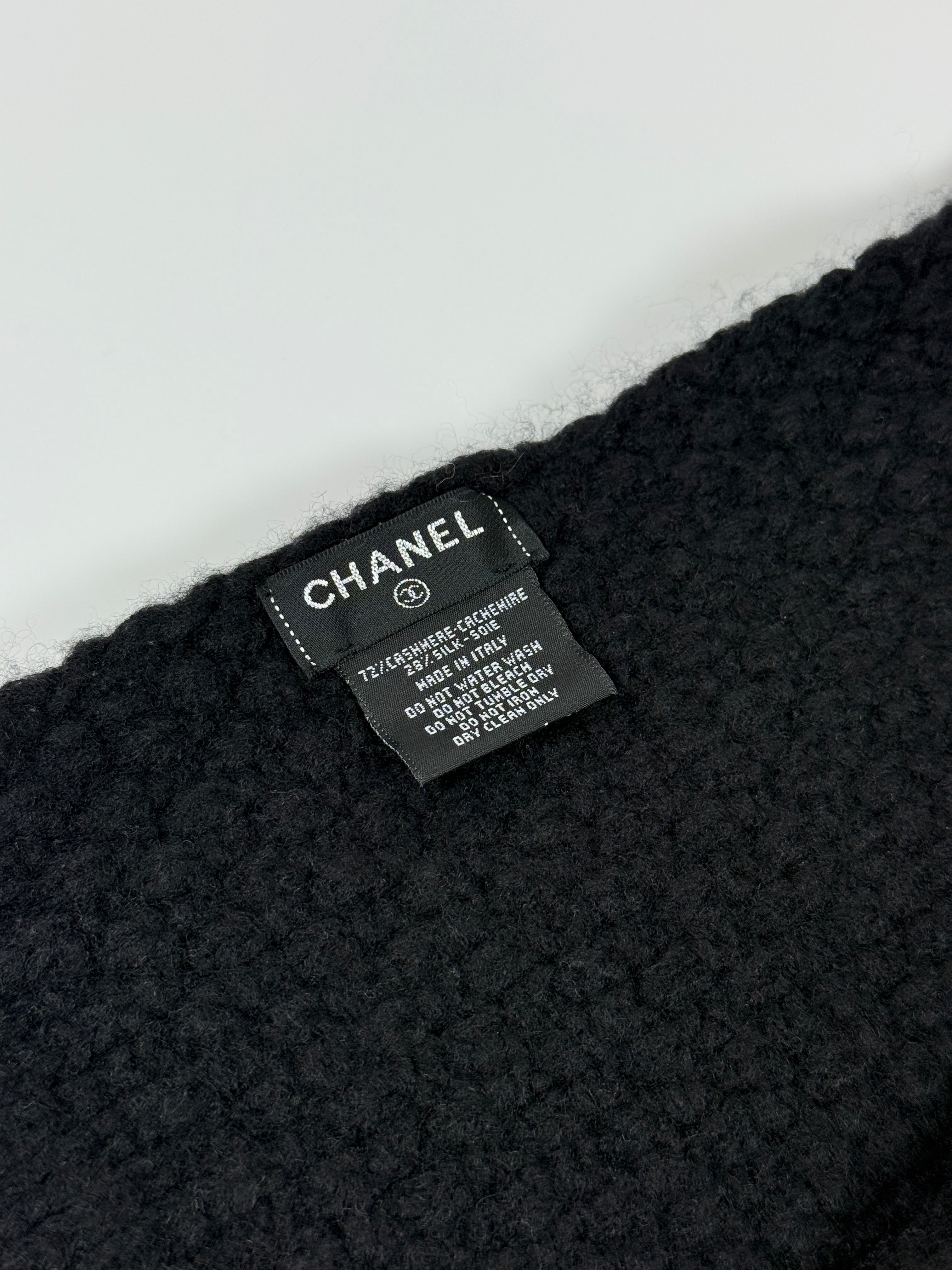 Authentic and preloved Chanel Black Knit Logo Scarf with cc logo. Excellent condition. 100% Authenticity guarantee 