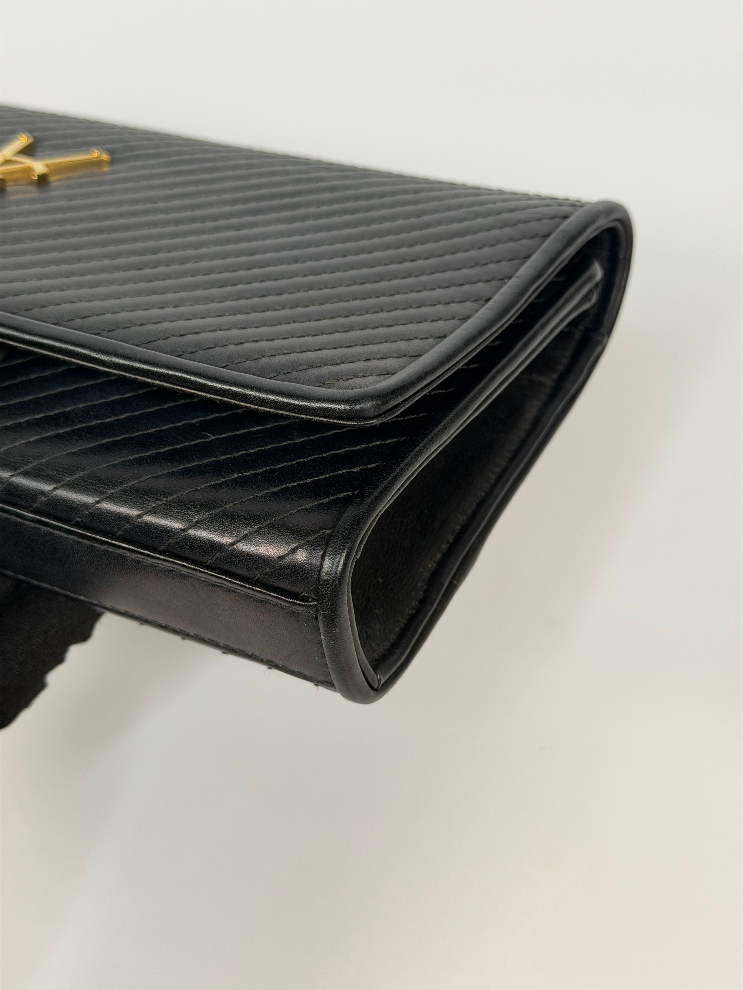 Saint Laurent Kate Long Clutch In Black Leather Gold Hardware. 100% authentic and preloved in very good condition