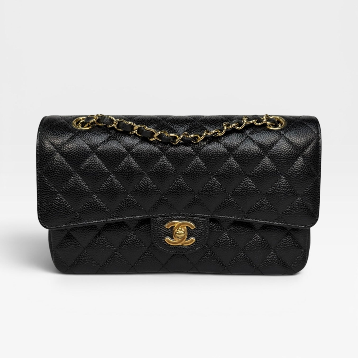 Chanel Medium Classic Double Flap In Black Caviar With Gold Hardware. Authentic and preloved in new and unused condition. 