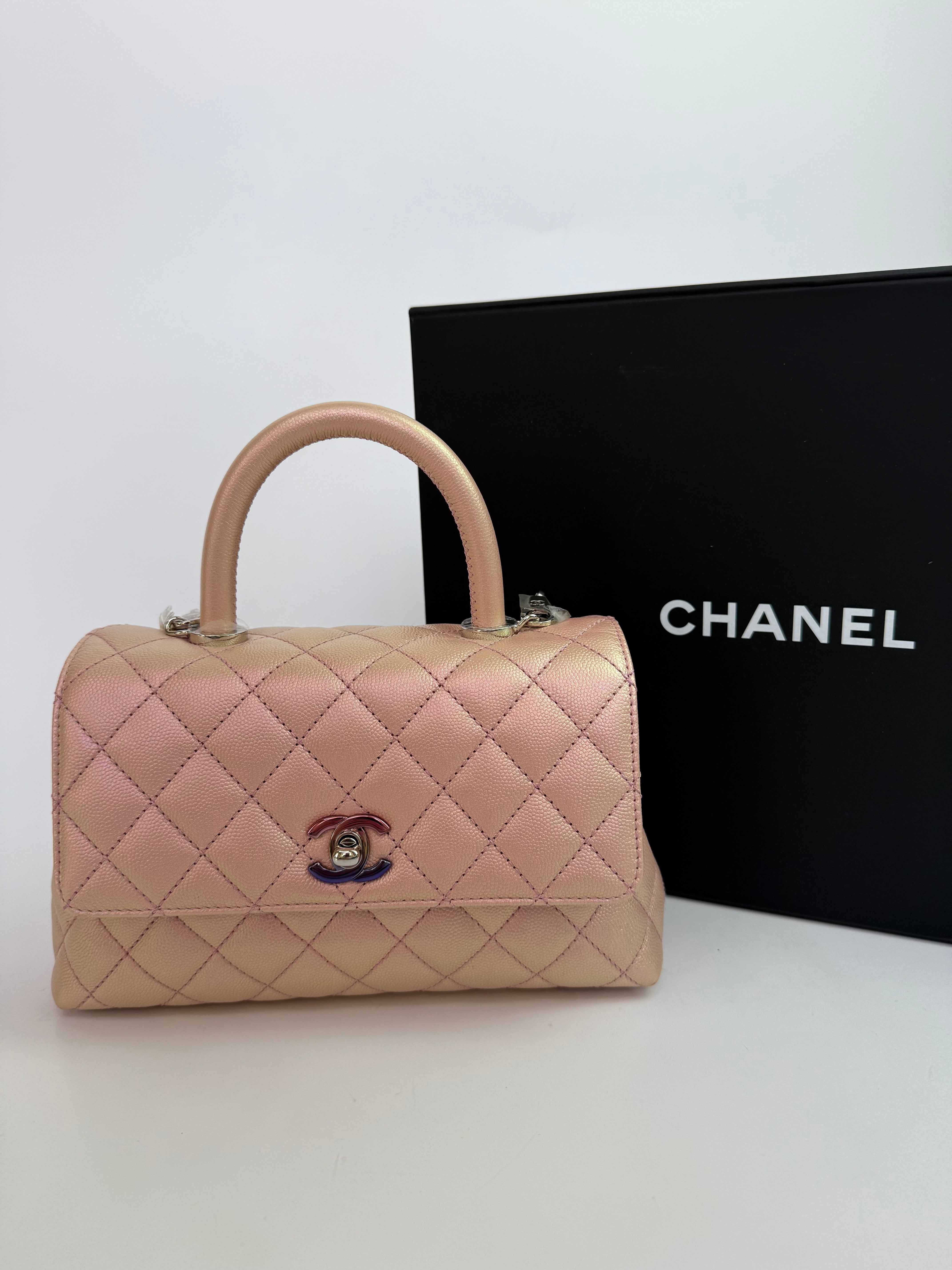 Authentic pre-loved Chanel Small Coco In Iridescent Pink Caviar With Rainbow Hardware. 