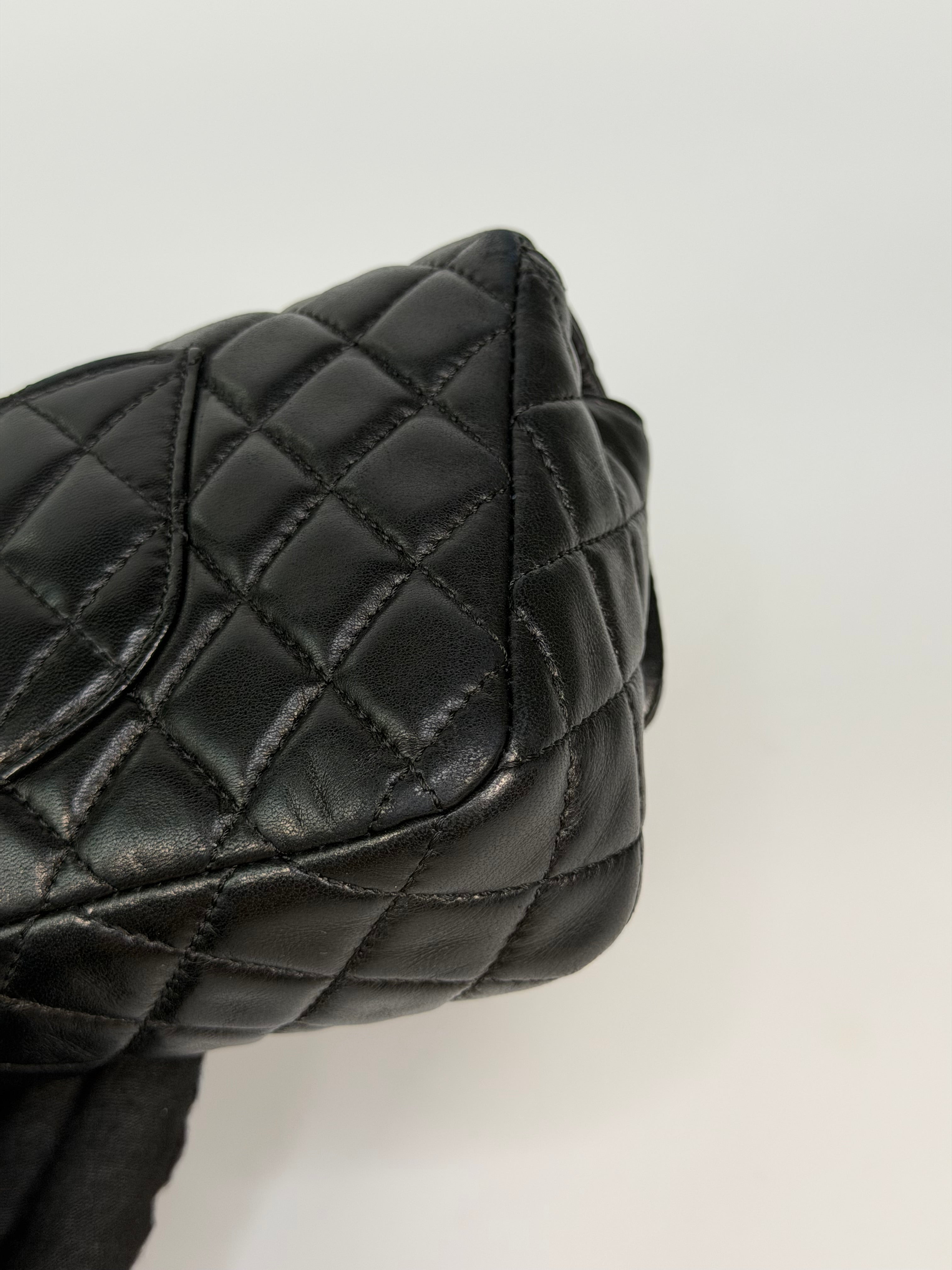 Chanel East West Charms Bag In Black Lambskin Leather With Gold Hardware. Authentic and preloved in excellent condition. 100% guarantee