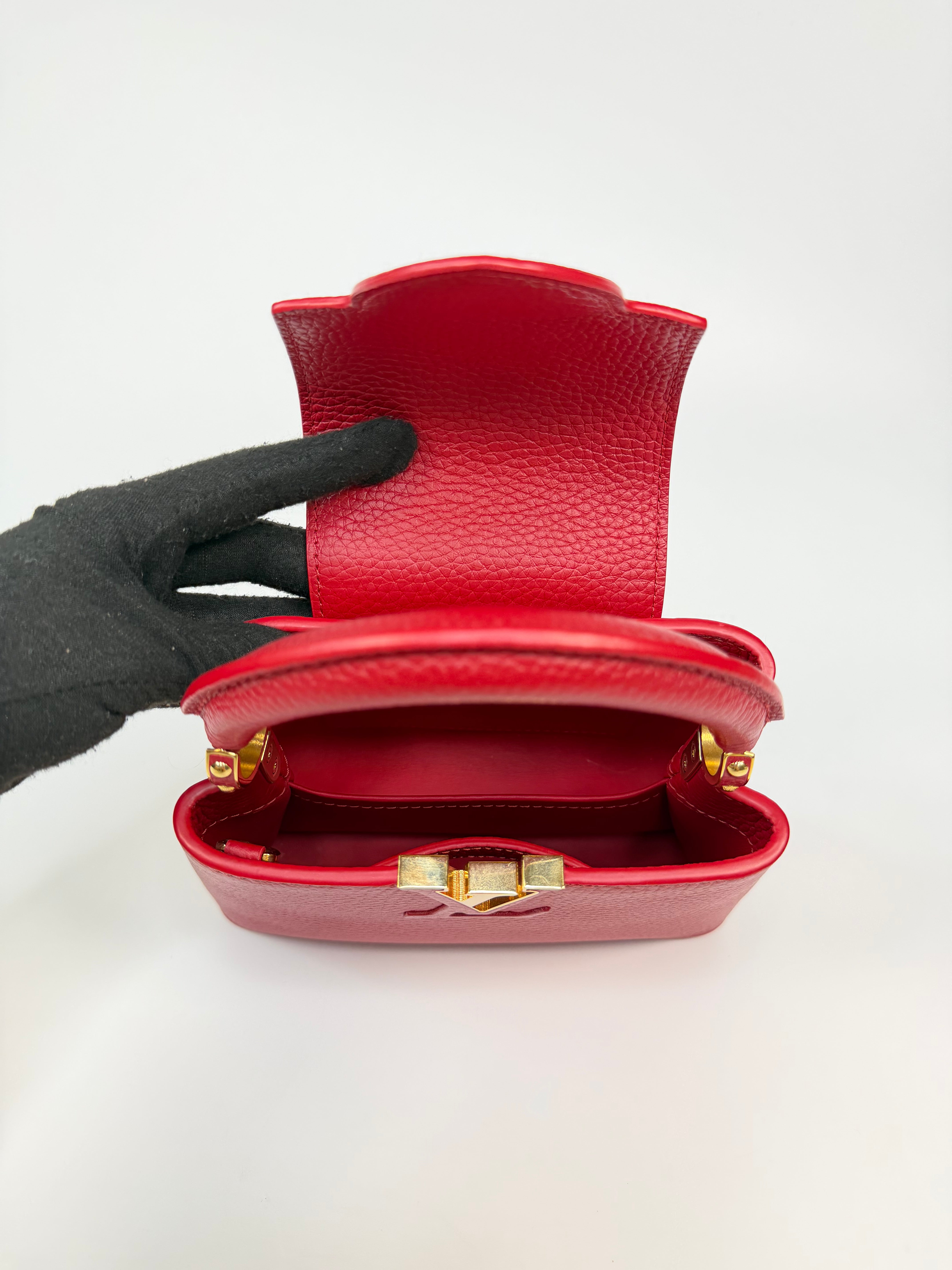 Louis Vuitton Capucines BB Bag In Scarlet Taurillion Leather With Gold Hardware. Authentic and preloved in excellent condition
