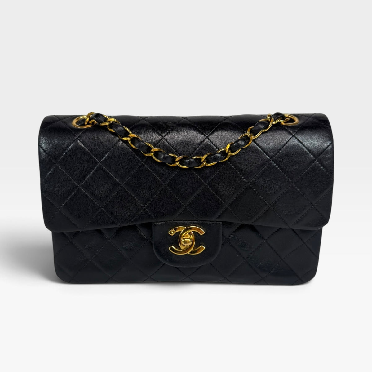 Chanel Vintage Small Classic Double Flap In Black Lambskin Leather 24Kt Hardware. Authentic and preloved in excellent condition. 100% guarantee
