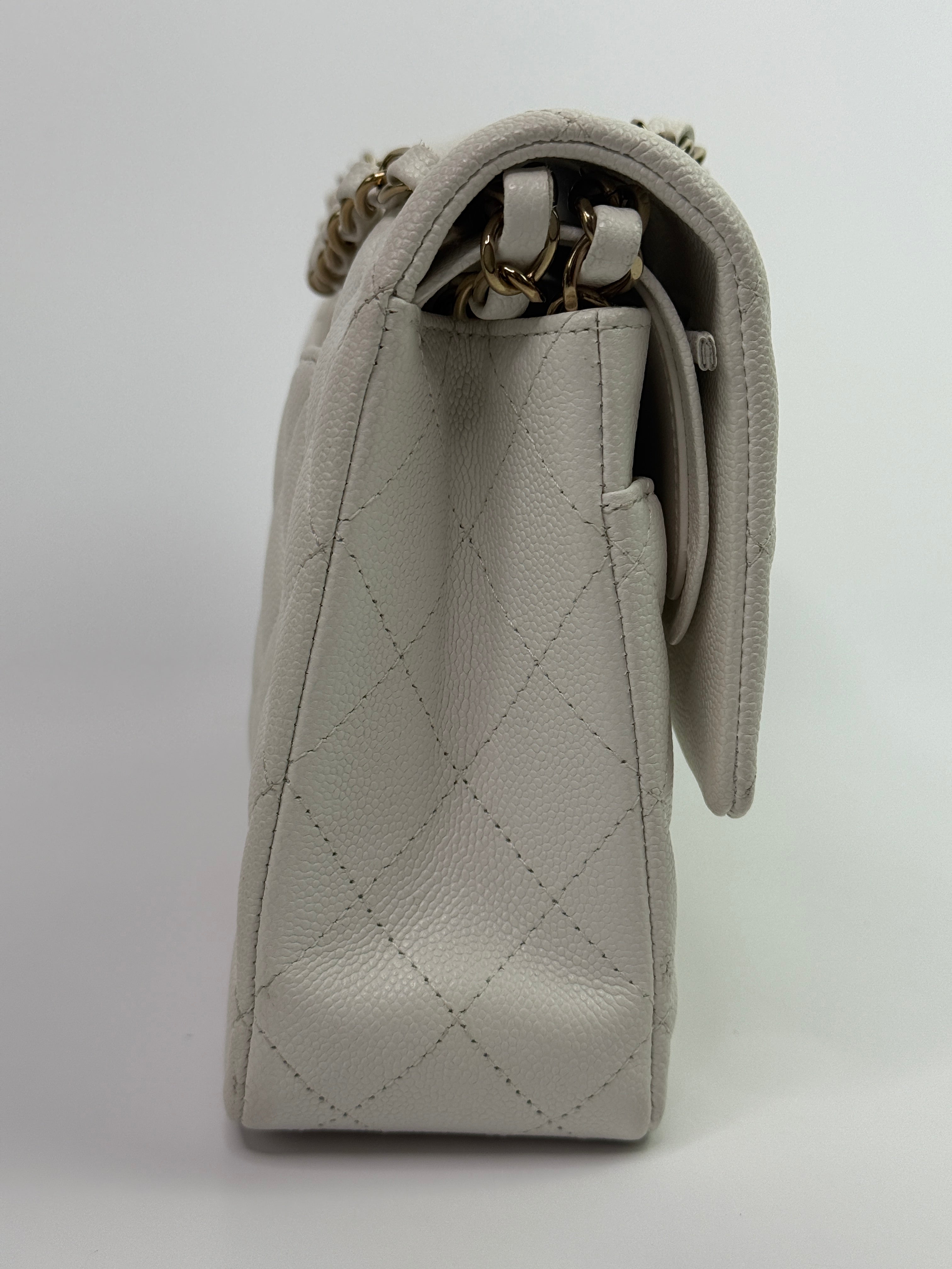Authentic pre-loved Chanel Medium Classic Double Flap White Caviar Leather With Gold Hardware. 
