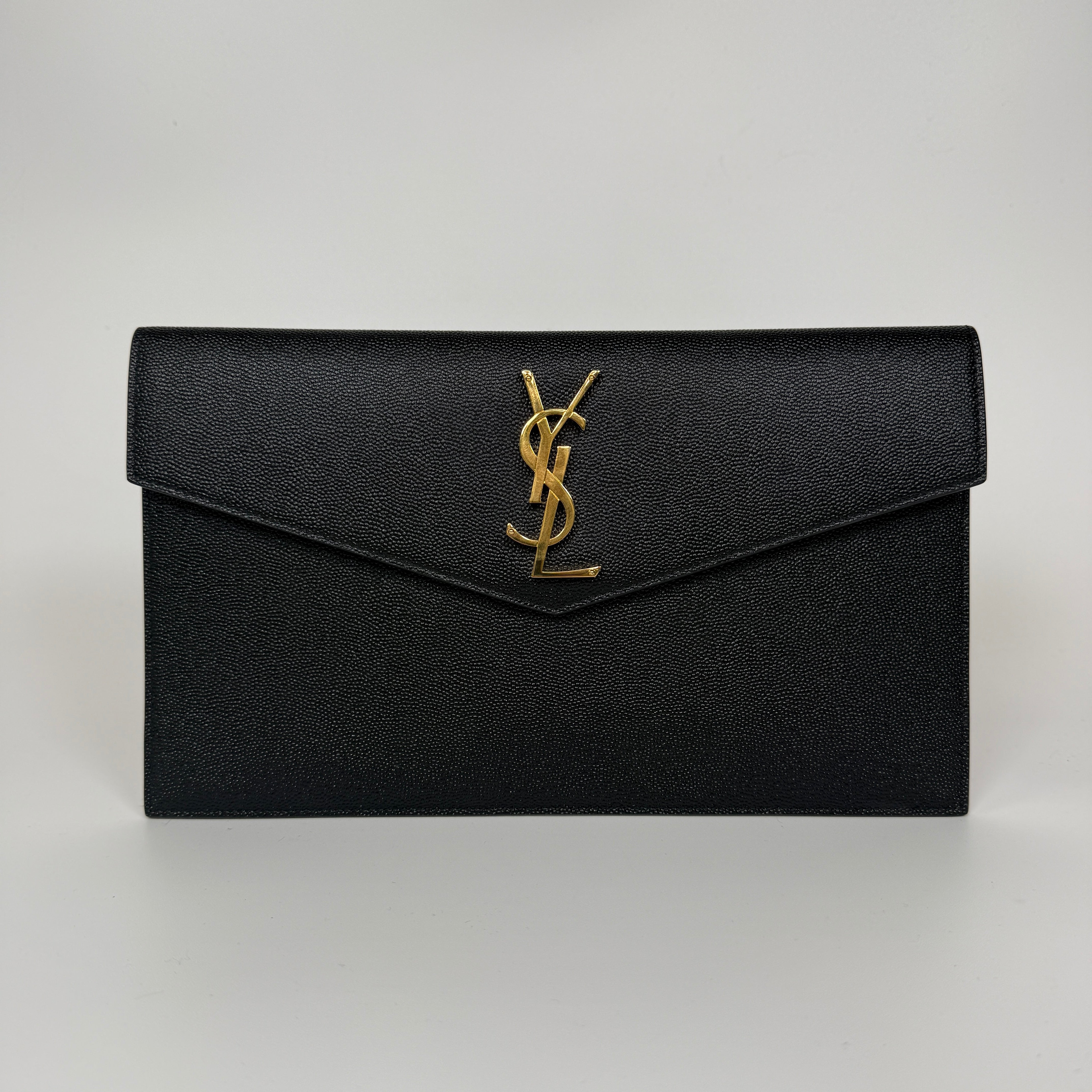 Saint Laurent Uptown Clutch In Black Leather With Gold Hardware. Authentic and preloved, 100% authenticity guarantee 