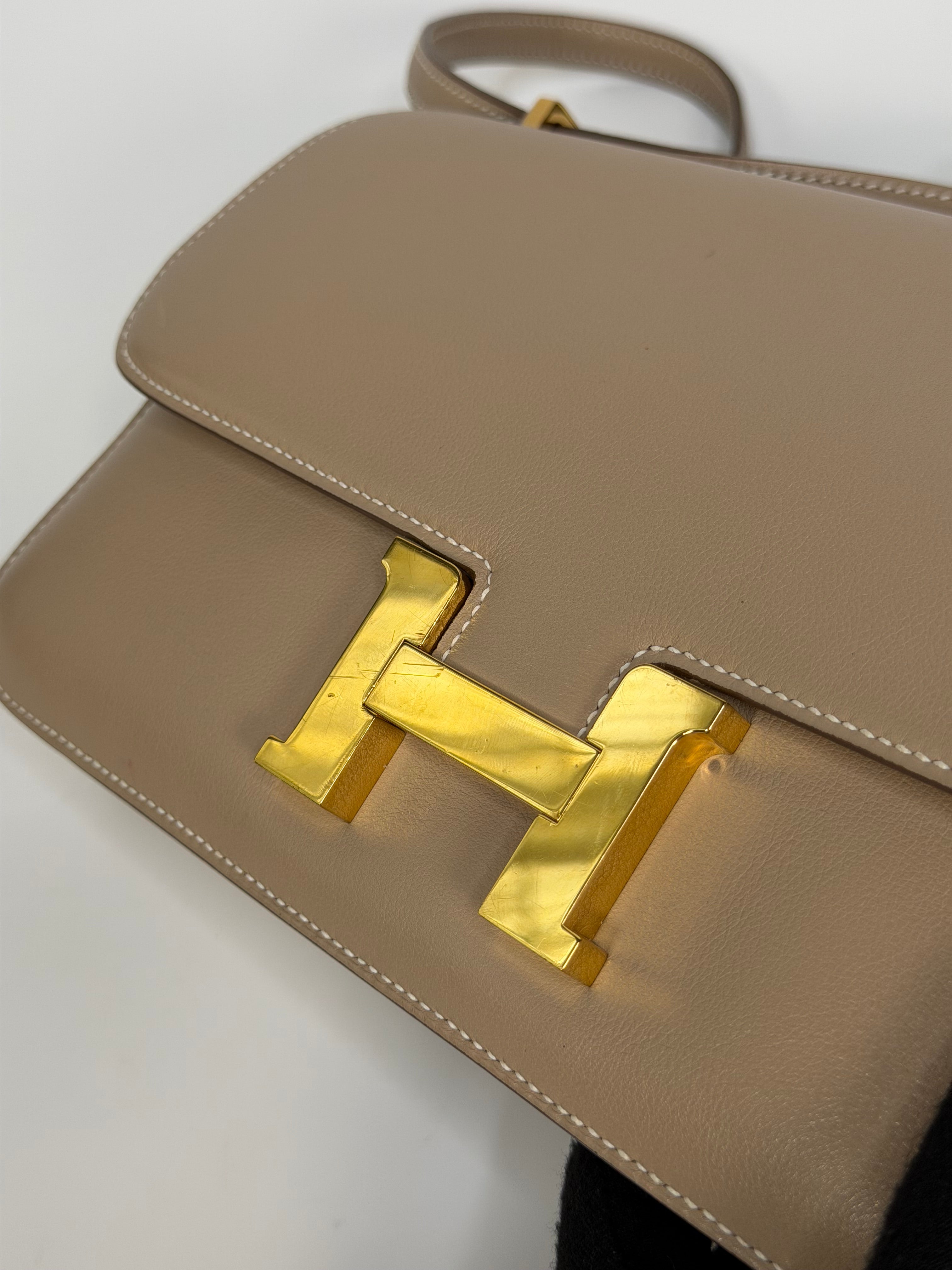 Hermès Constance Elan In Trench Swift Leather With Gold Hardware. Authentic and preloved in very good condition