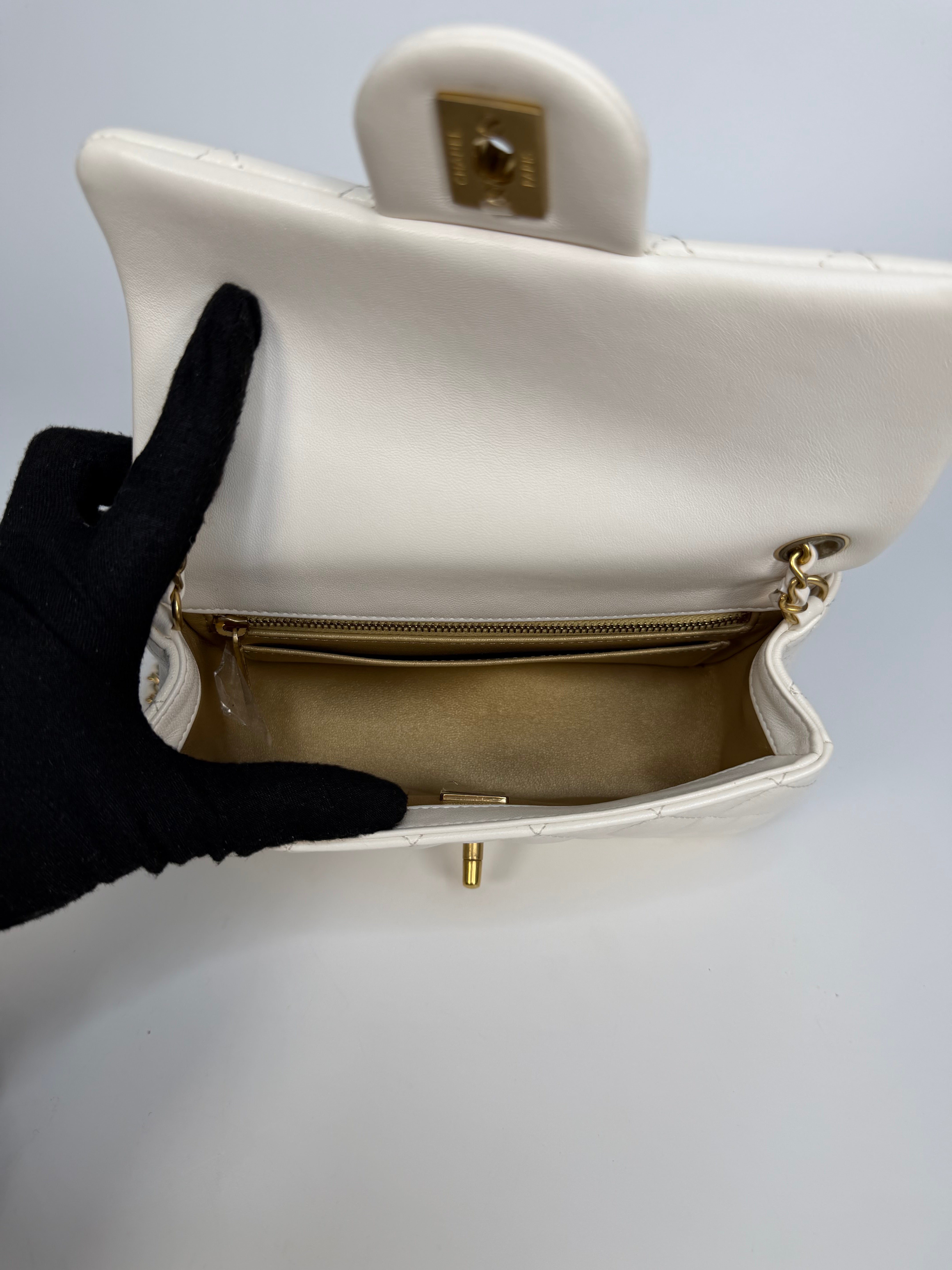 Chanel Pearl Crush Mini Rectangle In White Lambskin Leather Gold Hardware. Authentic and preloved in excellent condition with 100% authenticity guarantee.