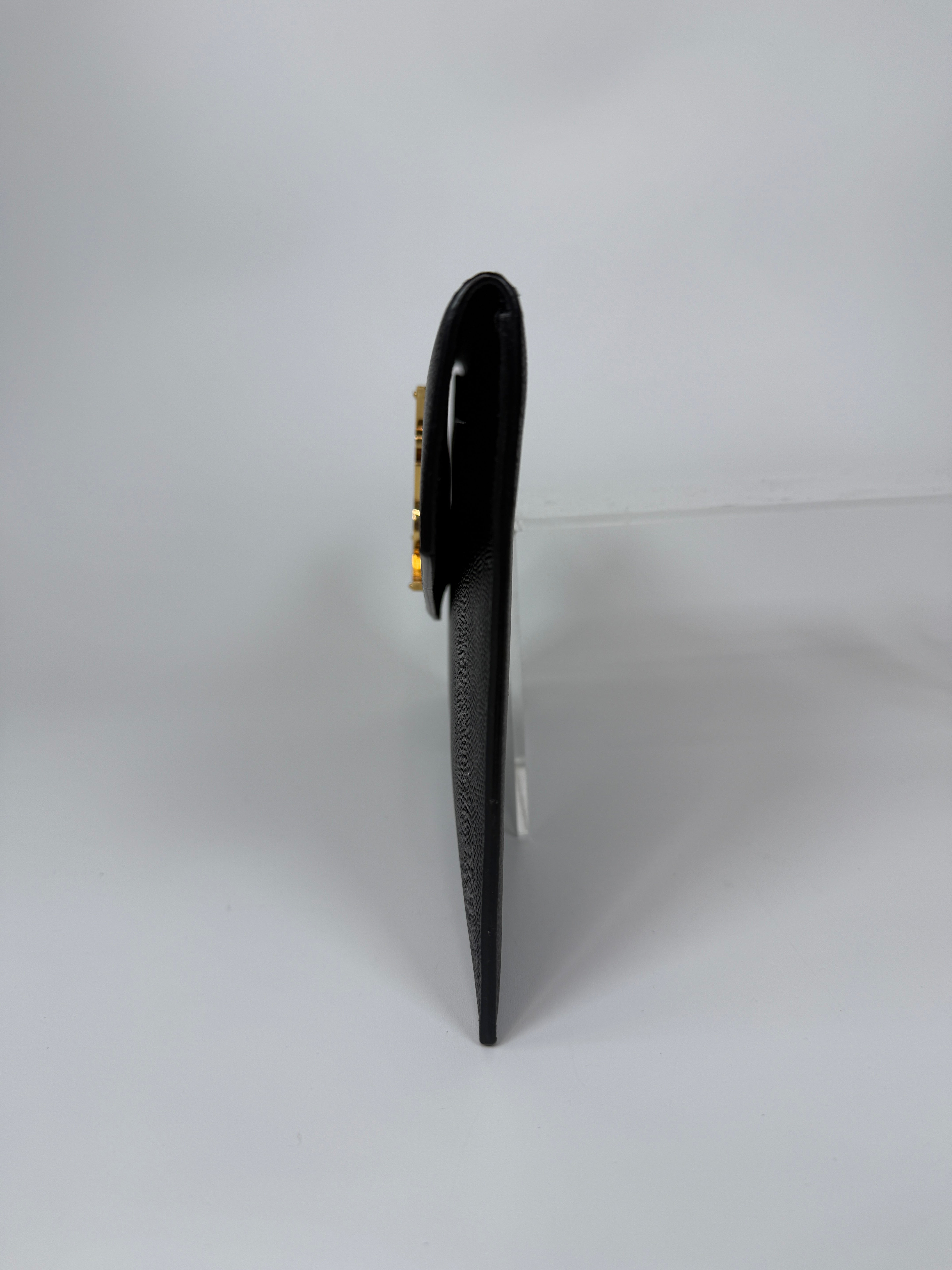 Saint Laurent Uptown Clutch In Black Leather With Gold Hardware. Authentic and preloved, 100% authenticity guarantee 