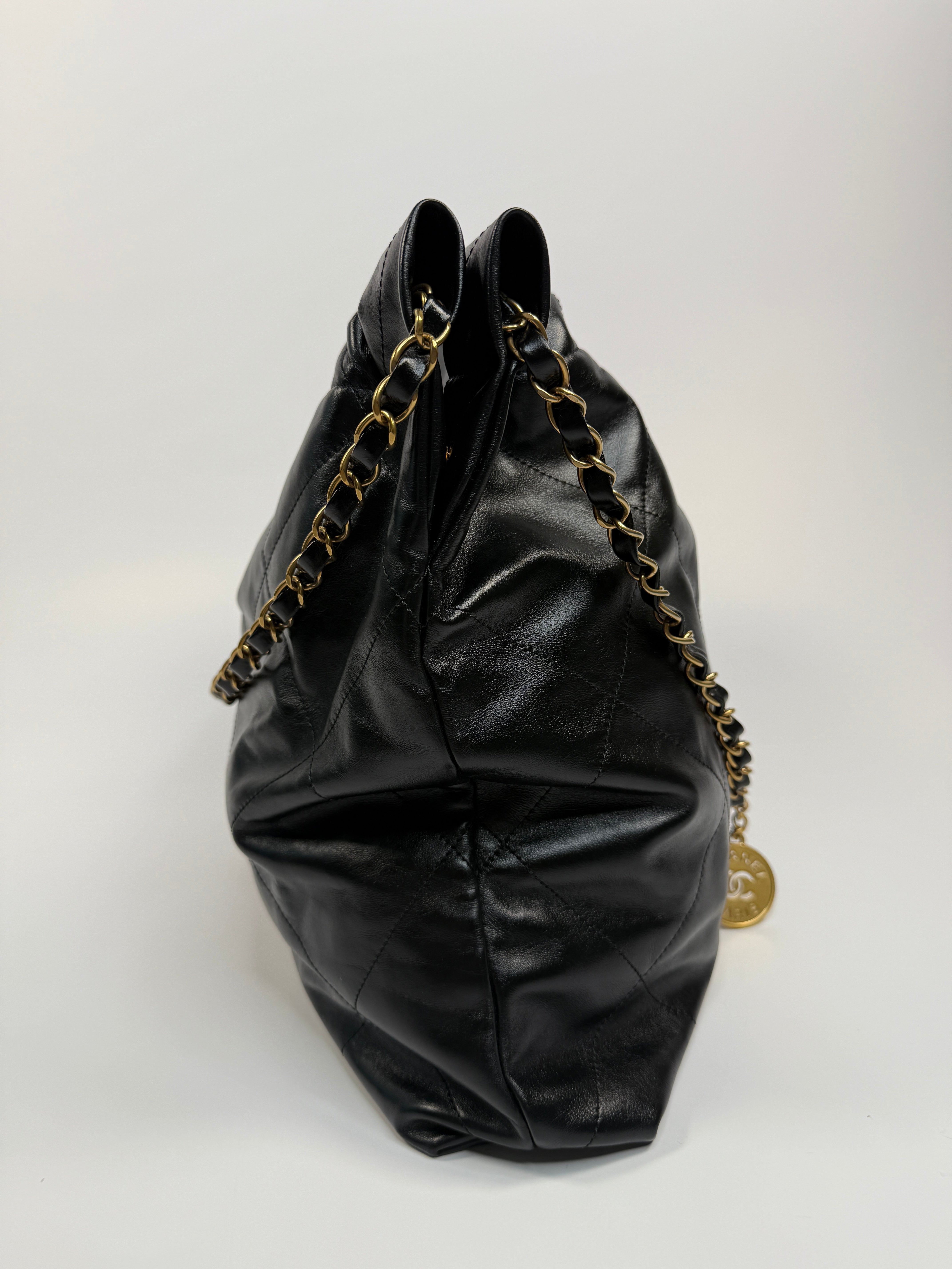 Chanel 22 Handbag In Black Calfskin Leather With Gold Hardware. Excellent Condition. Authentic and Preloved