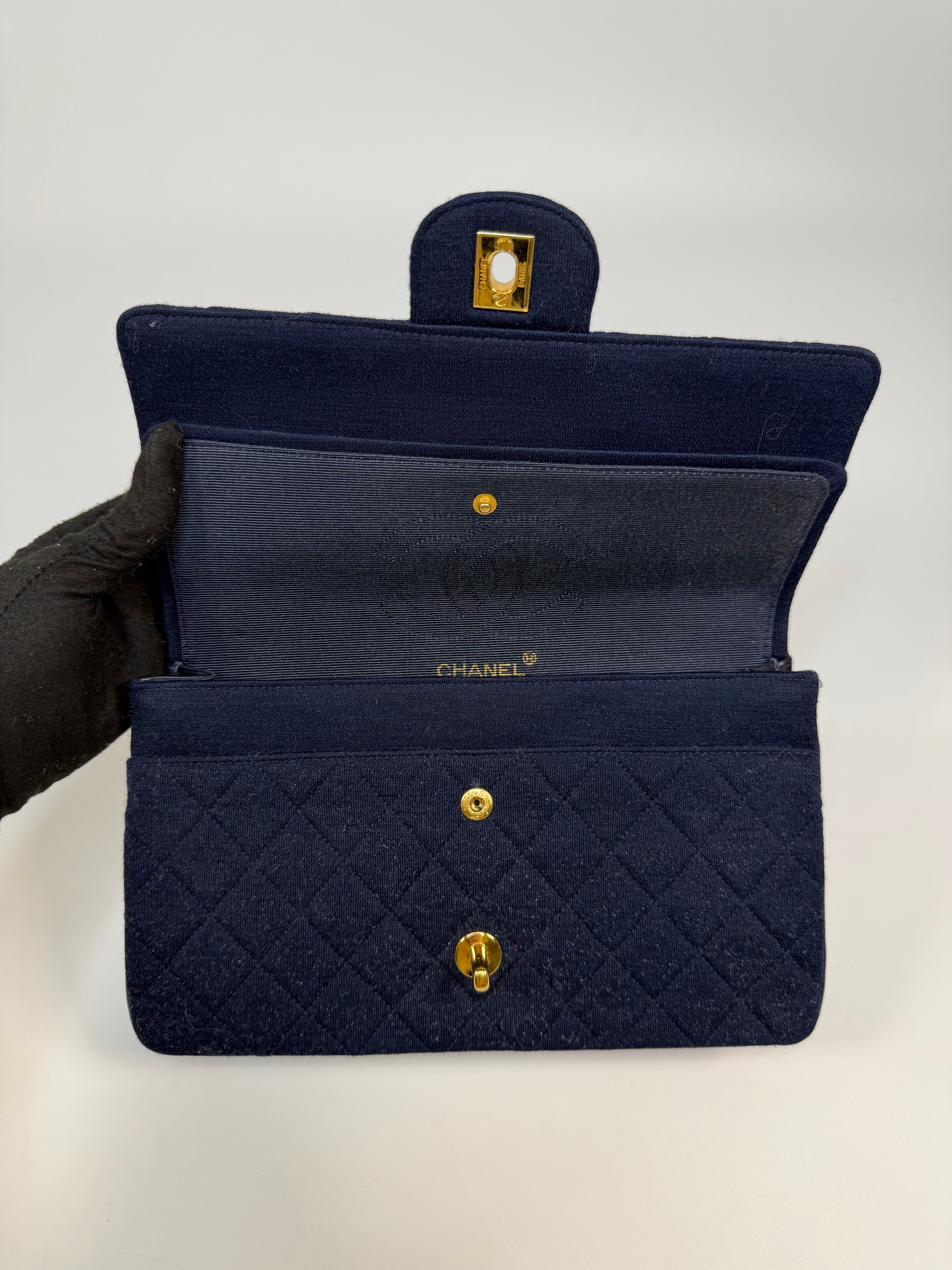 Chanel Vintage Medium Double Flap Navy Cotton With 24Kt Gold Hardware. Authentic and preloved in excellent condition.