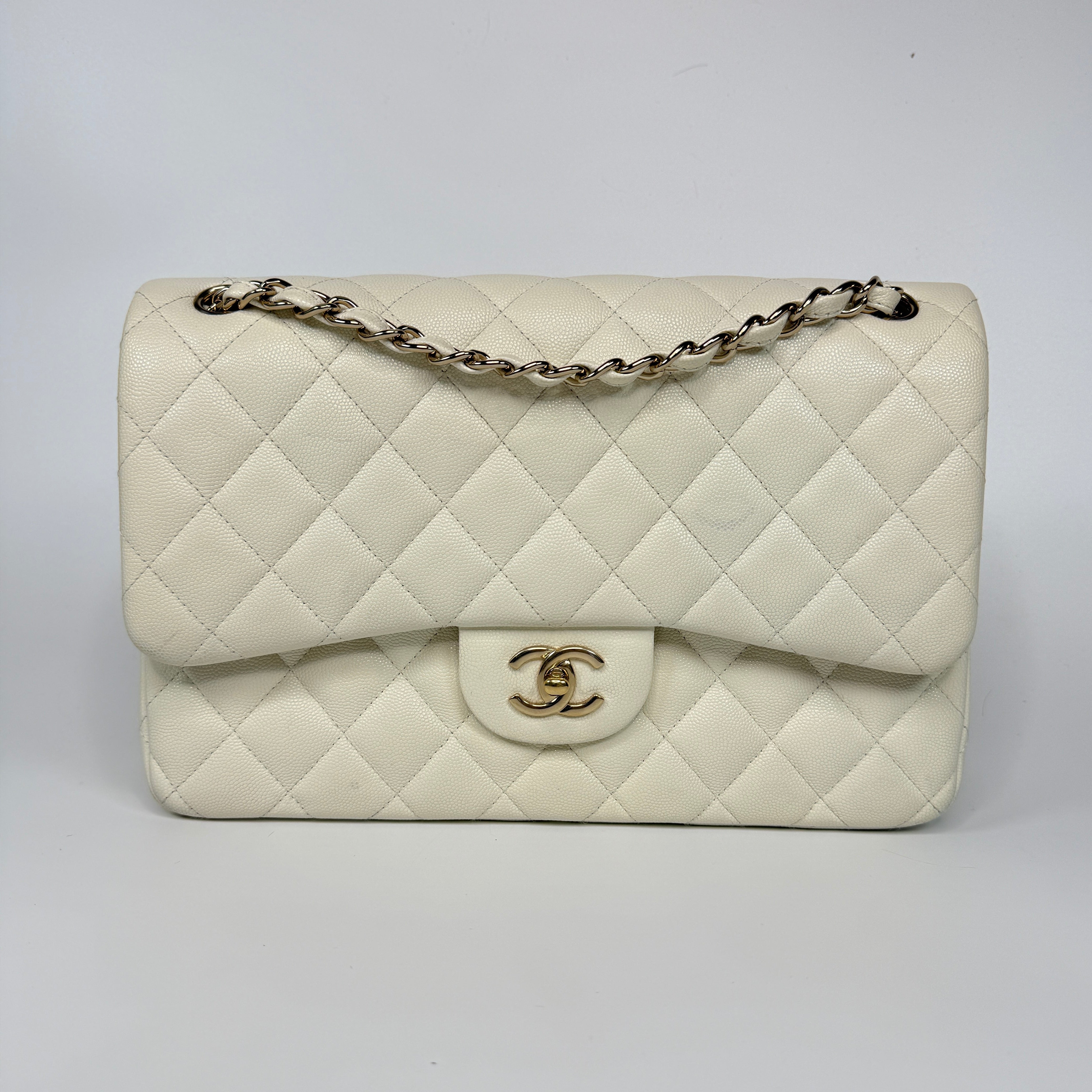 Authentic pre-loved Chanel Classic Jumbo Flap Bag In White Caviar Leather With pale gold  hardware in very good condition. Verified by Luxe Cheshire. International, fast  and fully insured delivery. Trusted designer resale.
