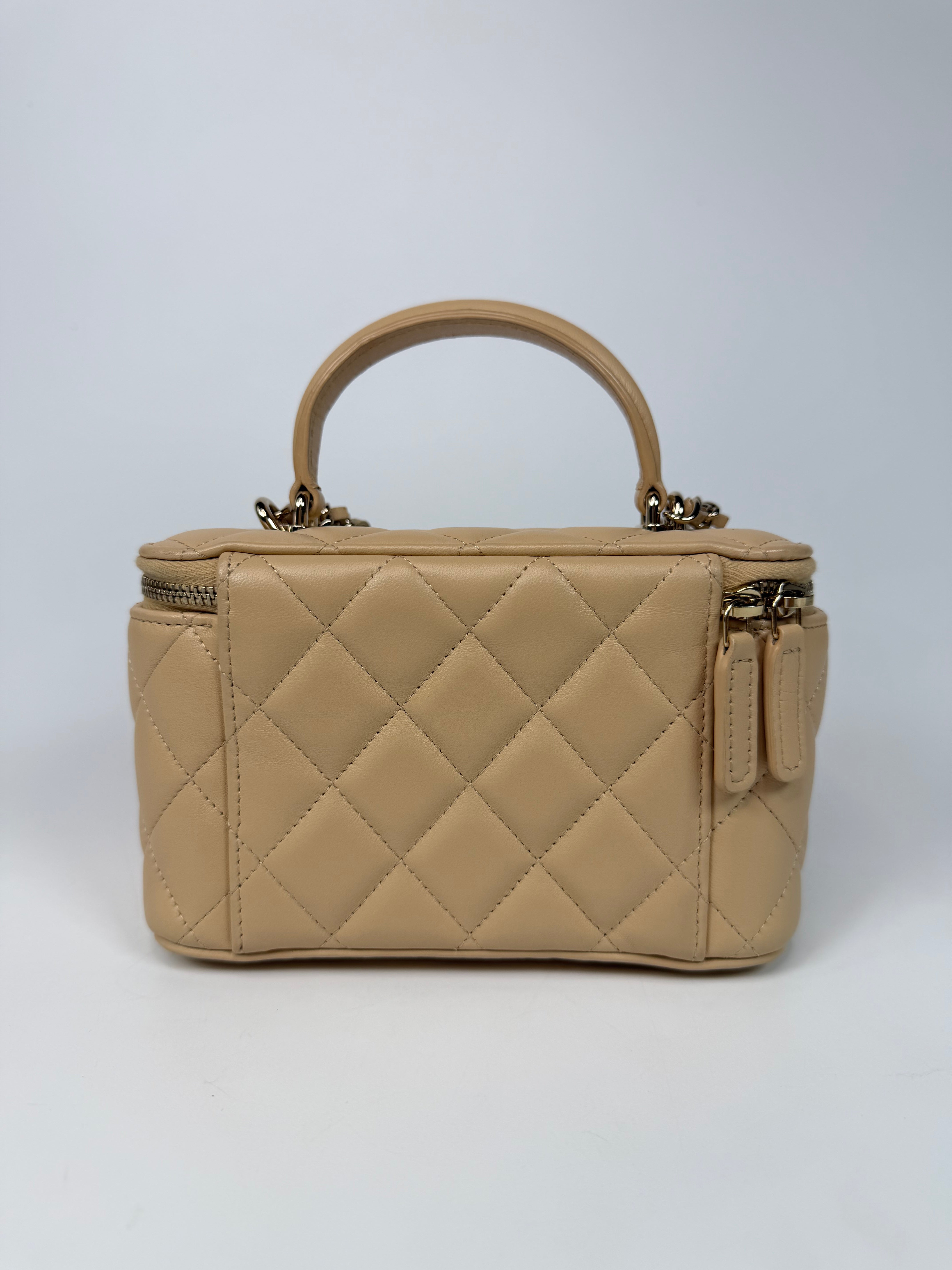 Chanel Mini Vanity Top Handle In Light Beige Lambskin Leather With Gold Hardware. Authentic and preloved in excellent condition. Insured next day delivery. Verified by Luxe Cheshire