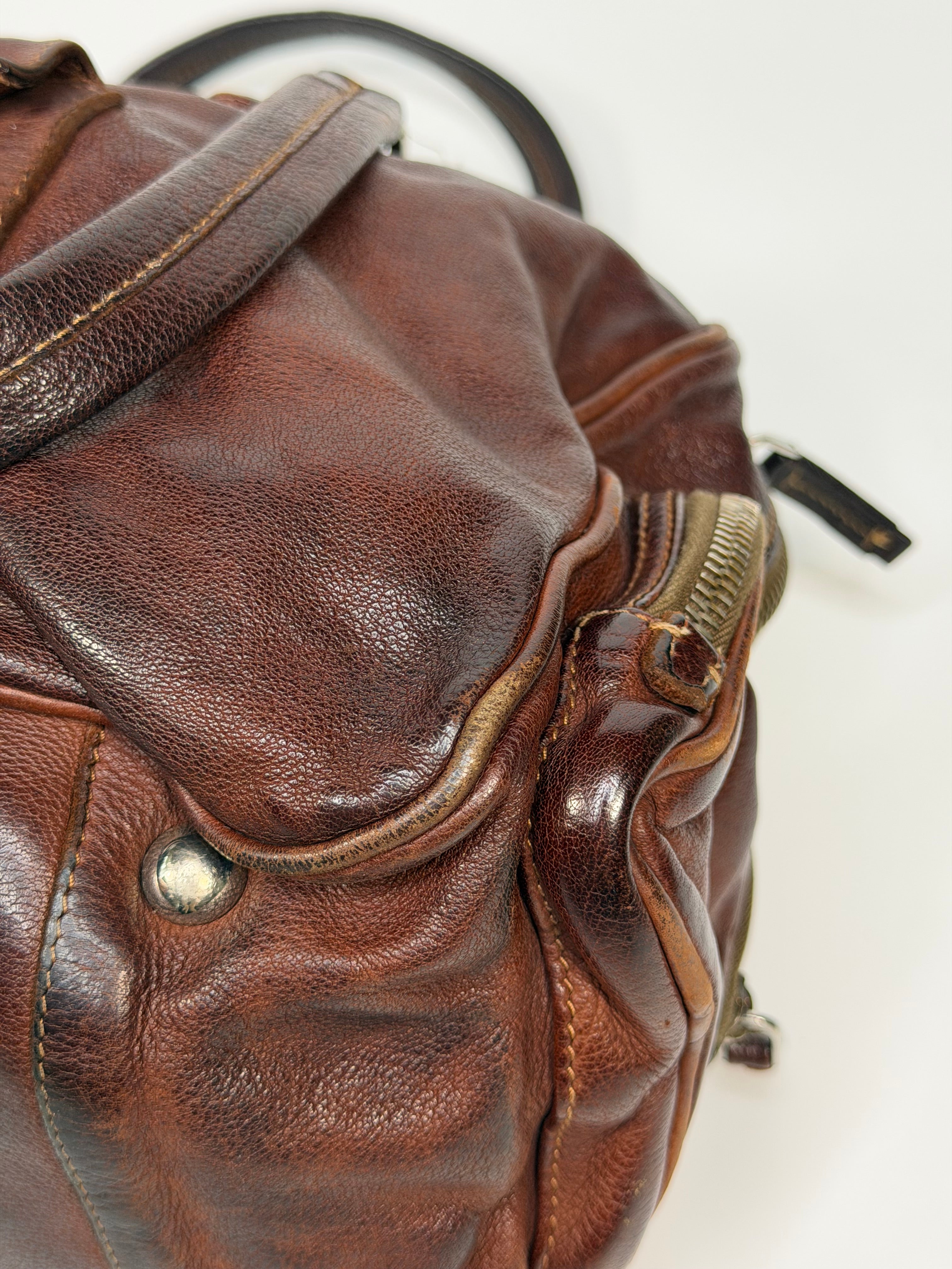Prada Washed Bauletto Shoulder Bag In Brown Leather With Gold Hardware. Authentic and preloved in very good condition