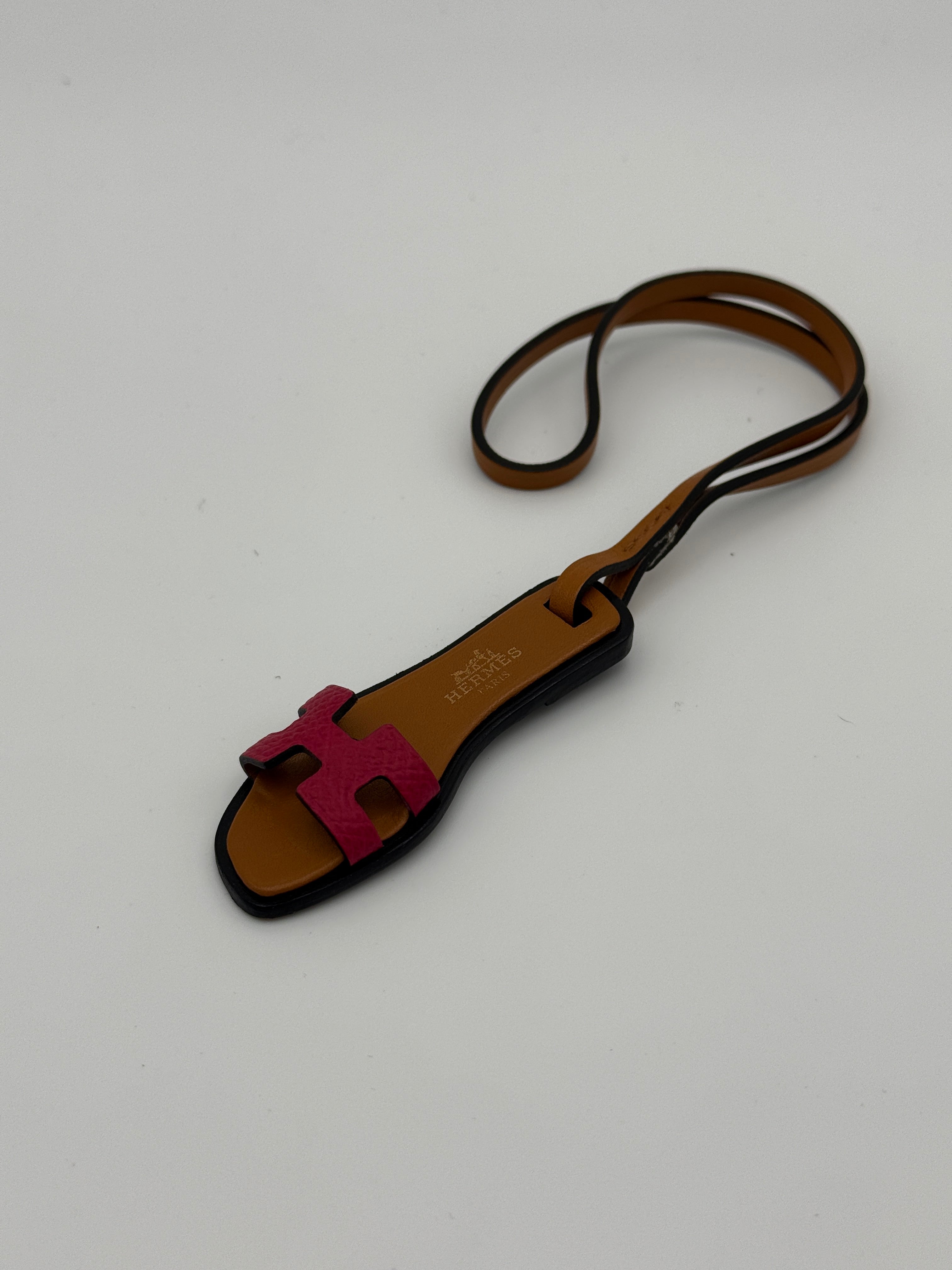 Hermes Oran Nano Bag Charm in Framboise/Natural Sable. Very Good Condition. Authentic and preloved 