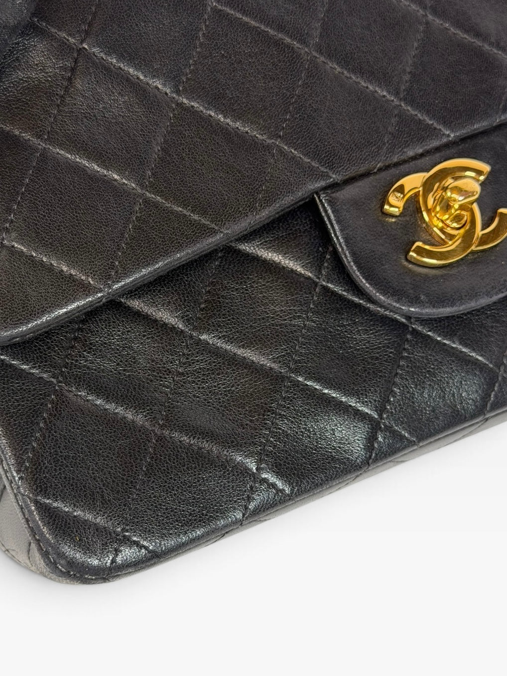 Chanel Vintage Small Classic Double Flap In Black Lambskin Leather 24Kt Hardware. Authentic and preloved in excellent condition. 100% guarantee