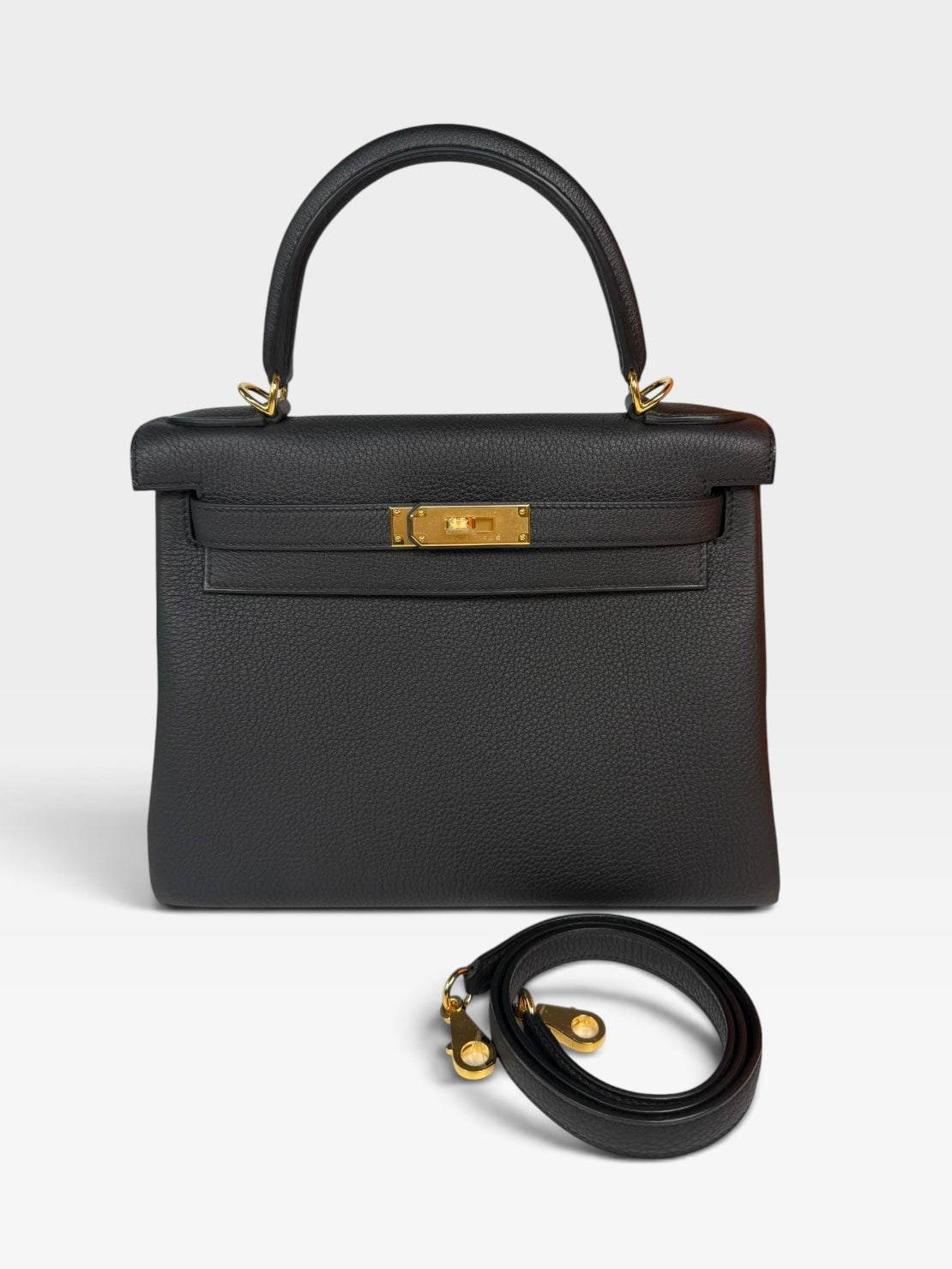 Authentic pre-loved Hermès Kelly 28 In Black Togo Leather Gold Hardware. New and Unused condition, verified by Luxe Cheshire. Trusted designer resale.