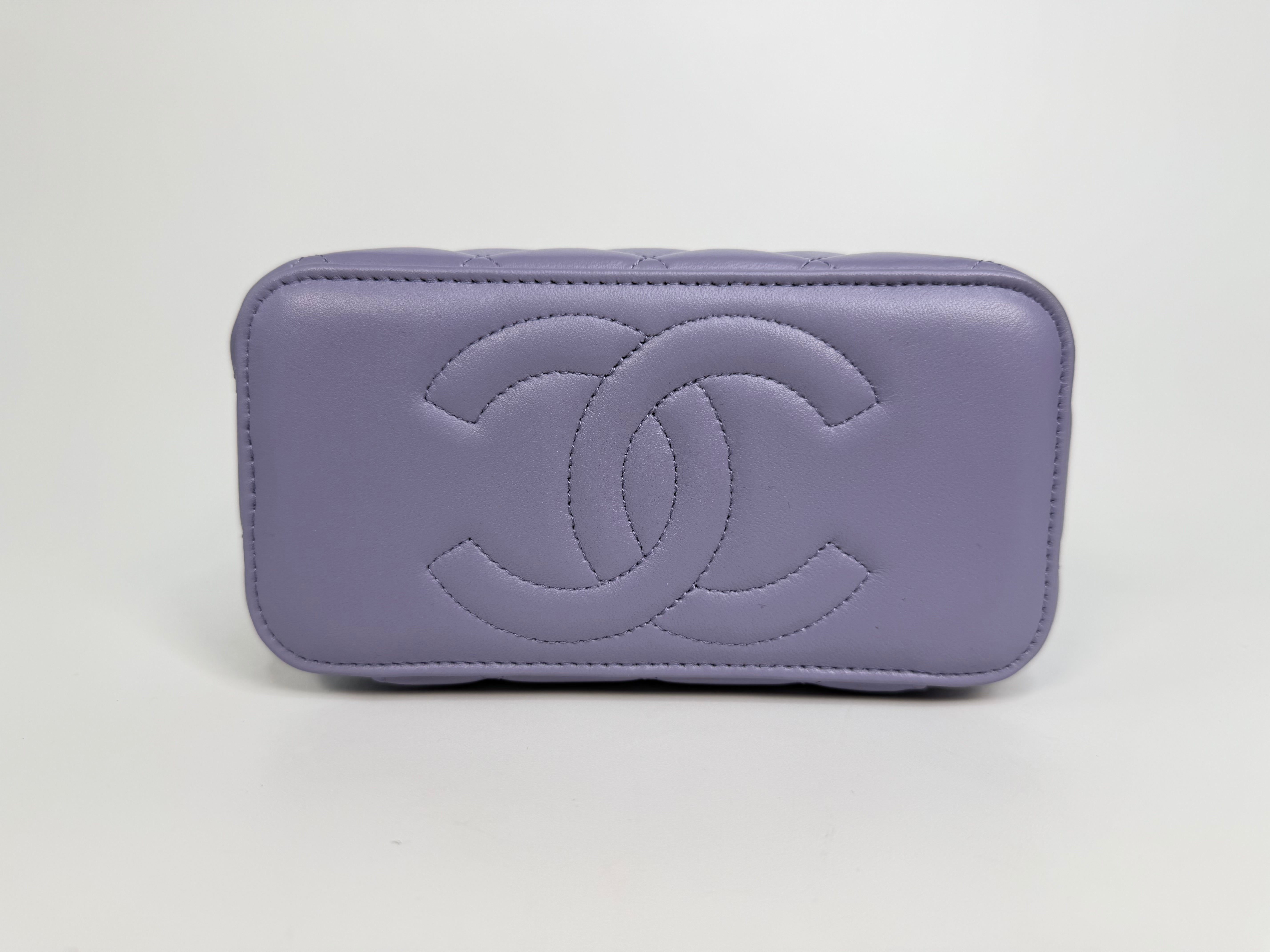 Chanel Mini Vanity Top Handle In Lilac Lambskin Leather With Gold Hardware. Authentic and preloved in excellent condition