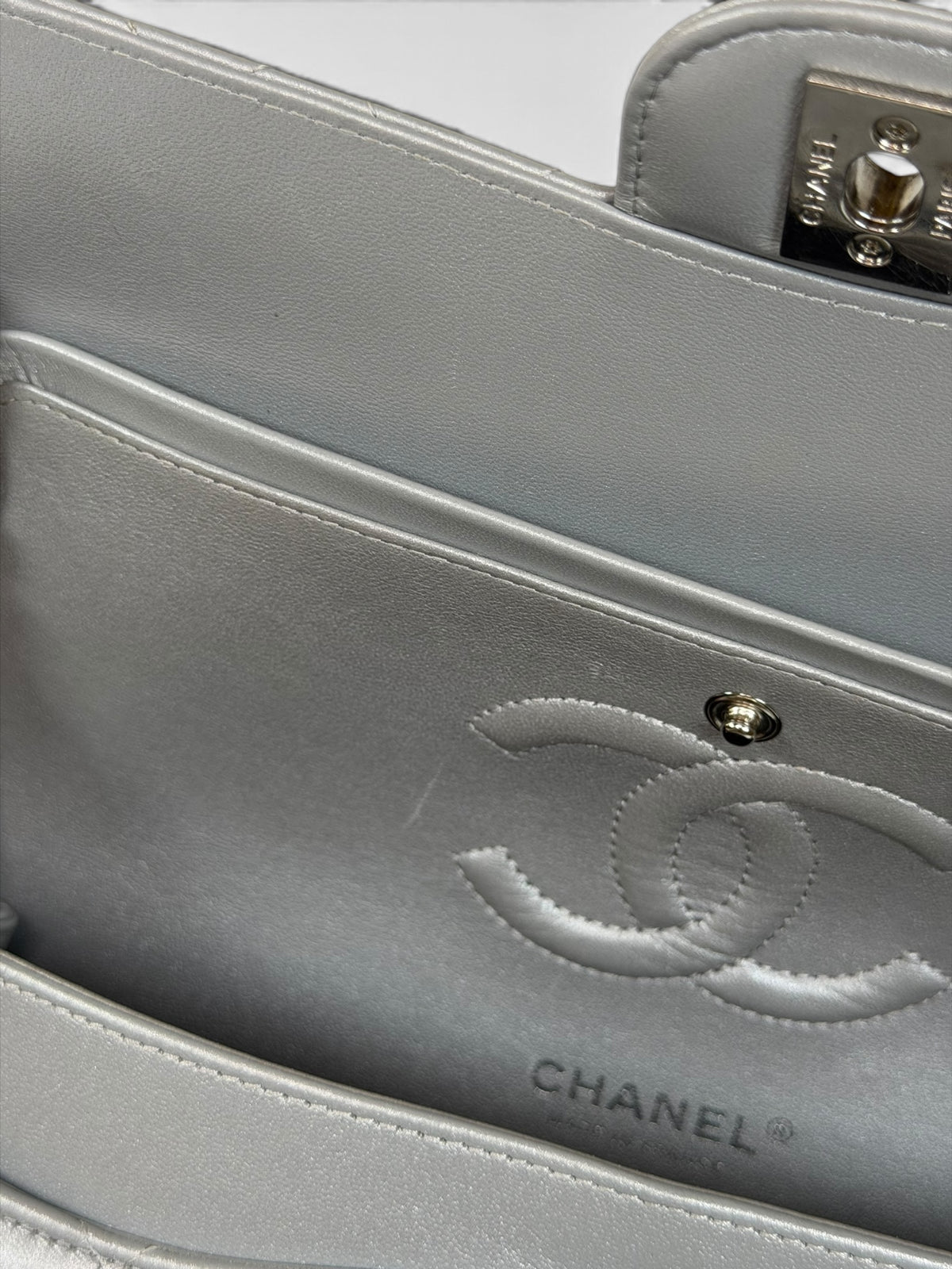 Chanel Medium Classic Double Flap In Silver Lambskin Leather Silver Hardware. 100% authentic and preloved in excellent condition