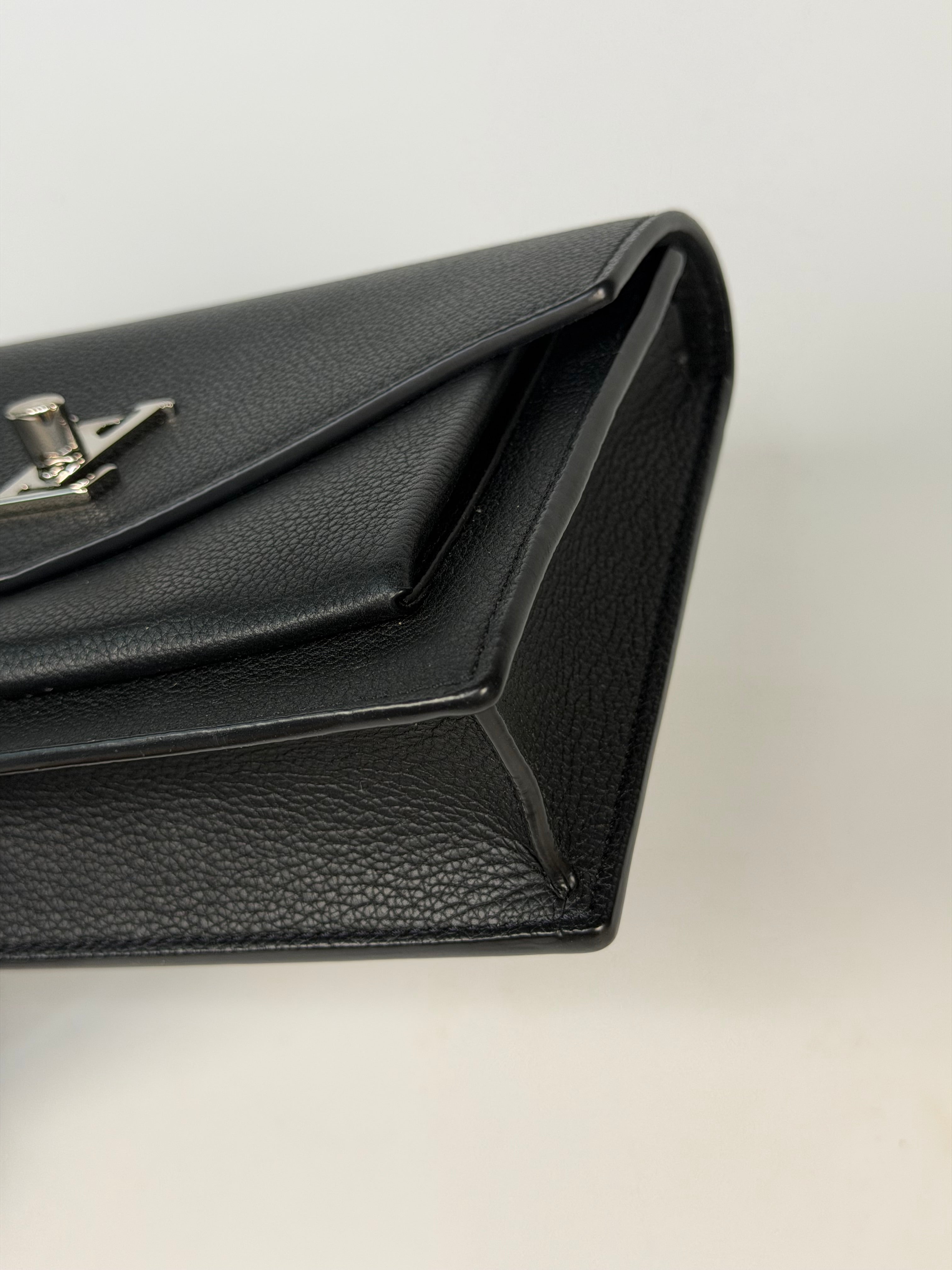 Louis Vuitton Pochette Chain MyLockMe In Black Leather With Silver Hardware in excellent condition 100% authentic and preloved 