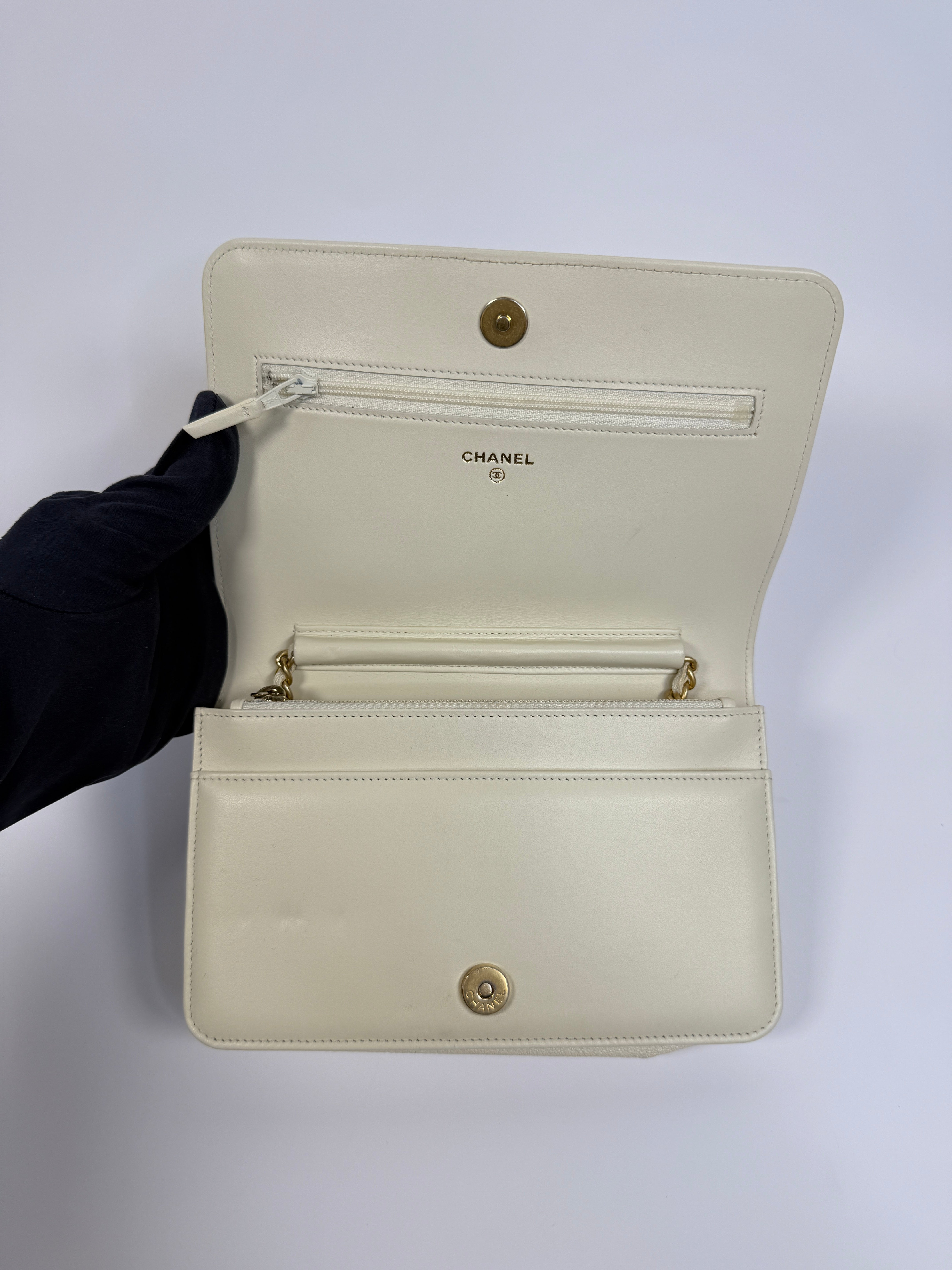 Authentic and pre loved Chanel Boy Wallet On Chain In White Caviar Leather With Gold Hardware. Excellent Condition