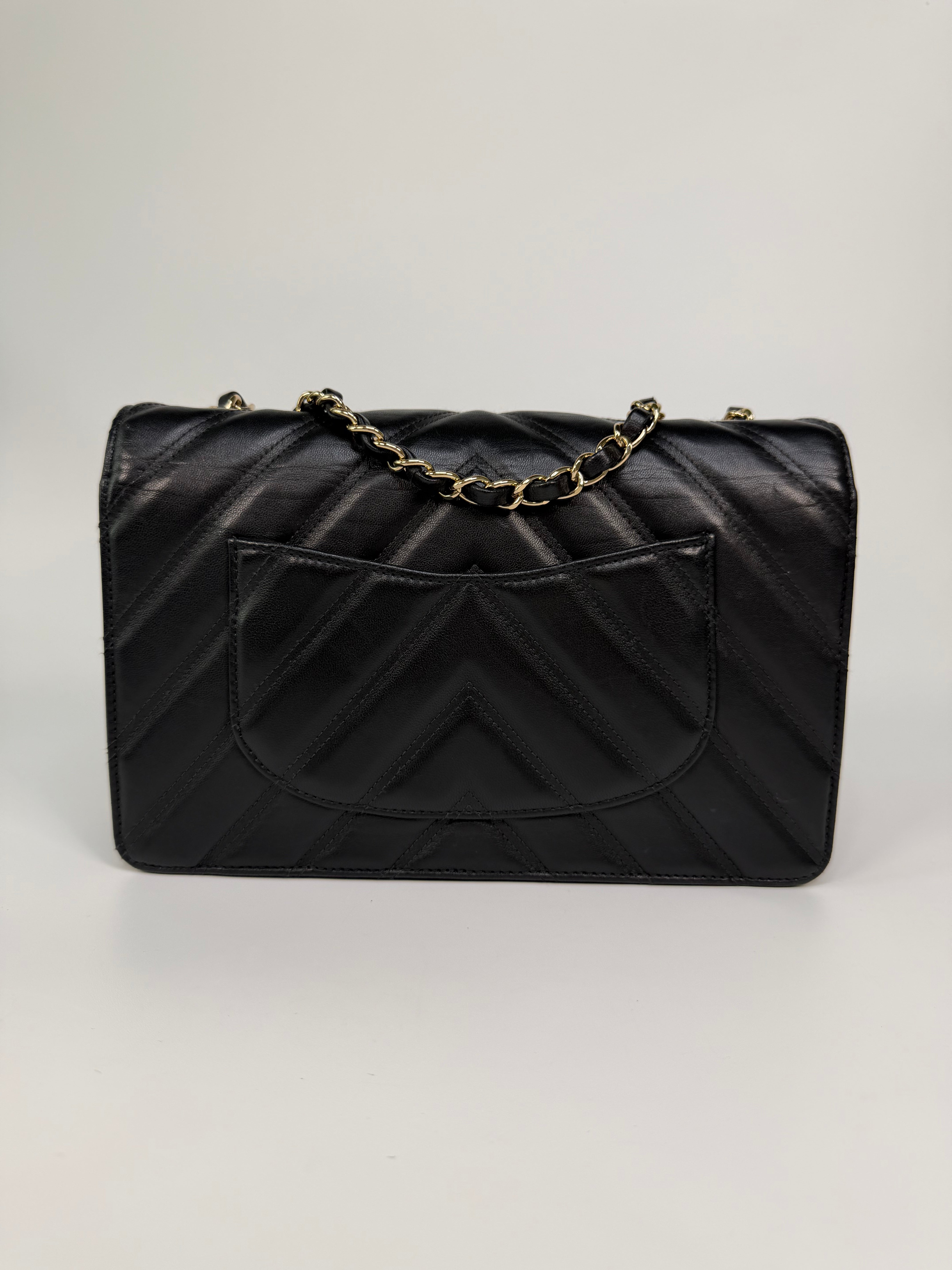 Chanel Chevron Flap In Black Lambskin Leather With Gold Hardware. Authentic and preloved in excellent condition. 100% guarantee