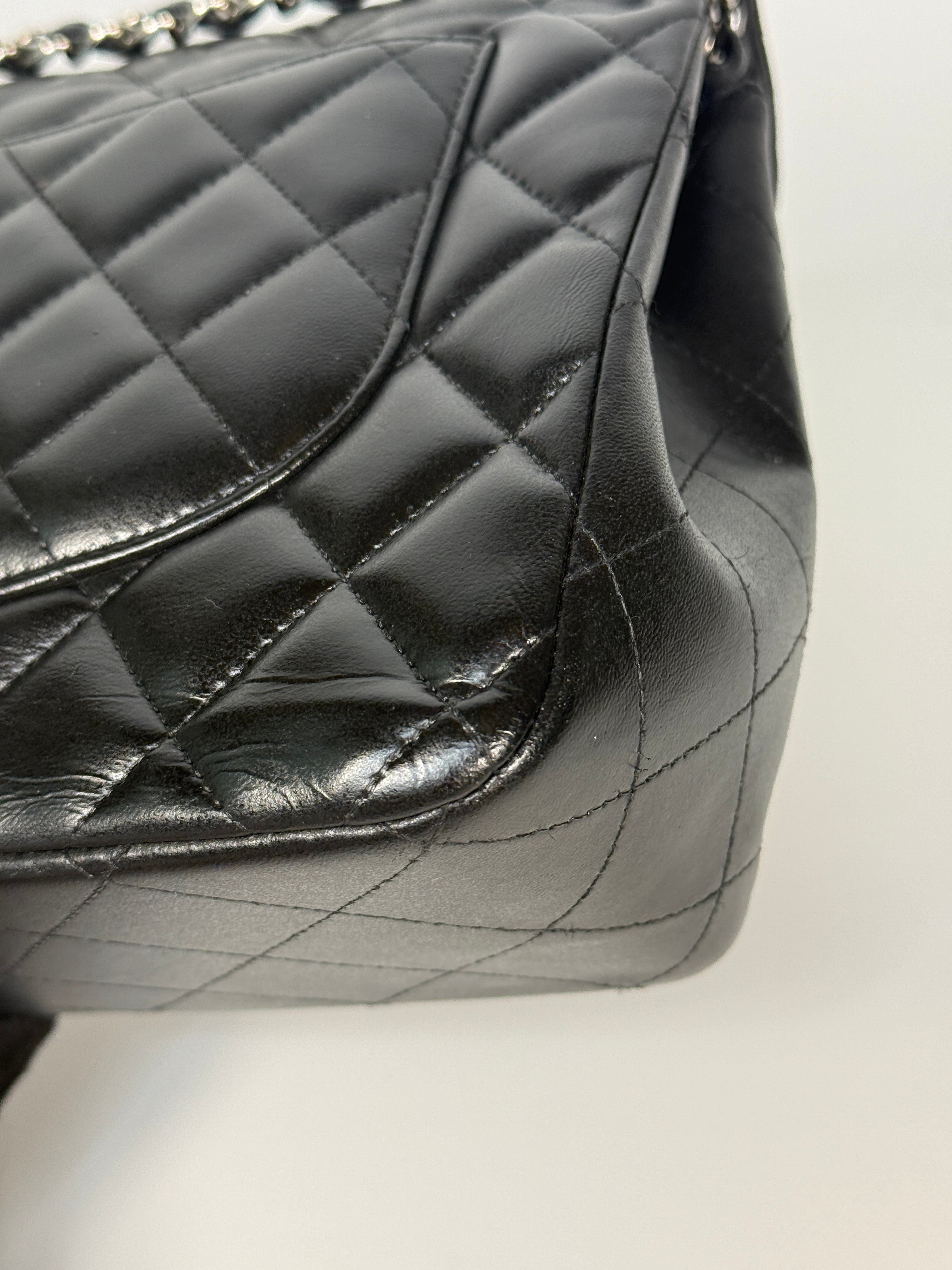 Authentic and preloved Chanel Jumbo Classic Flap Bag In Black Lambskin Leather With Silver hardware. Very Good condition. 100% Authenticity guarantee 