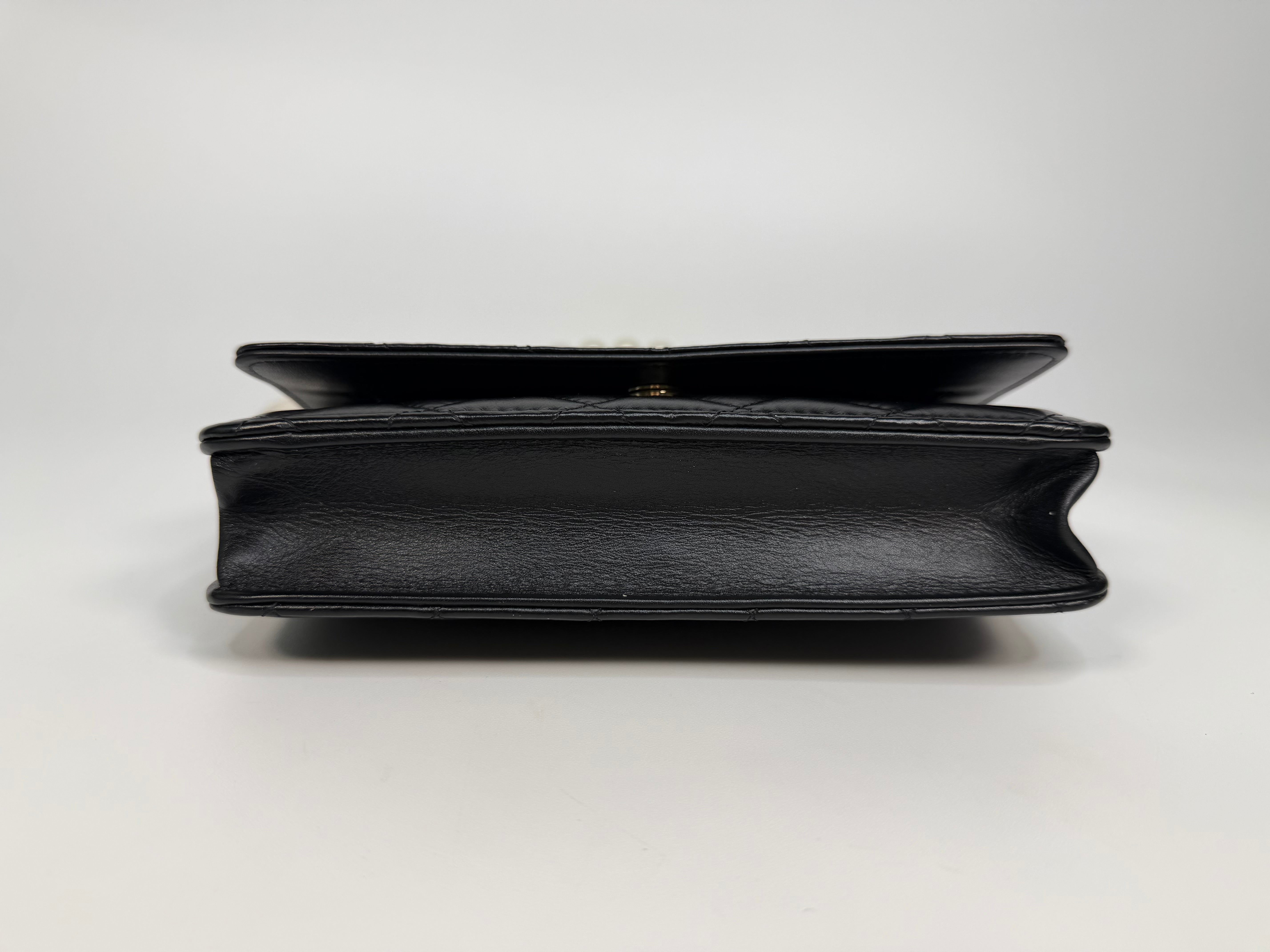 Chanel Pearl Wallet On Chain In Black Lambskin Leather With Gold Hardware. Authentic and preloved in very good condition.