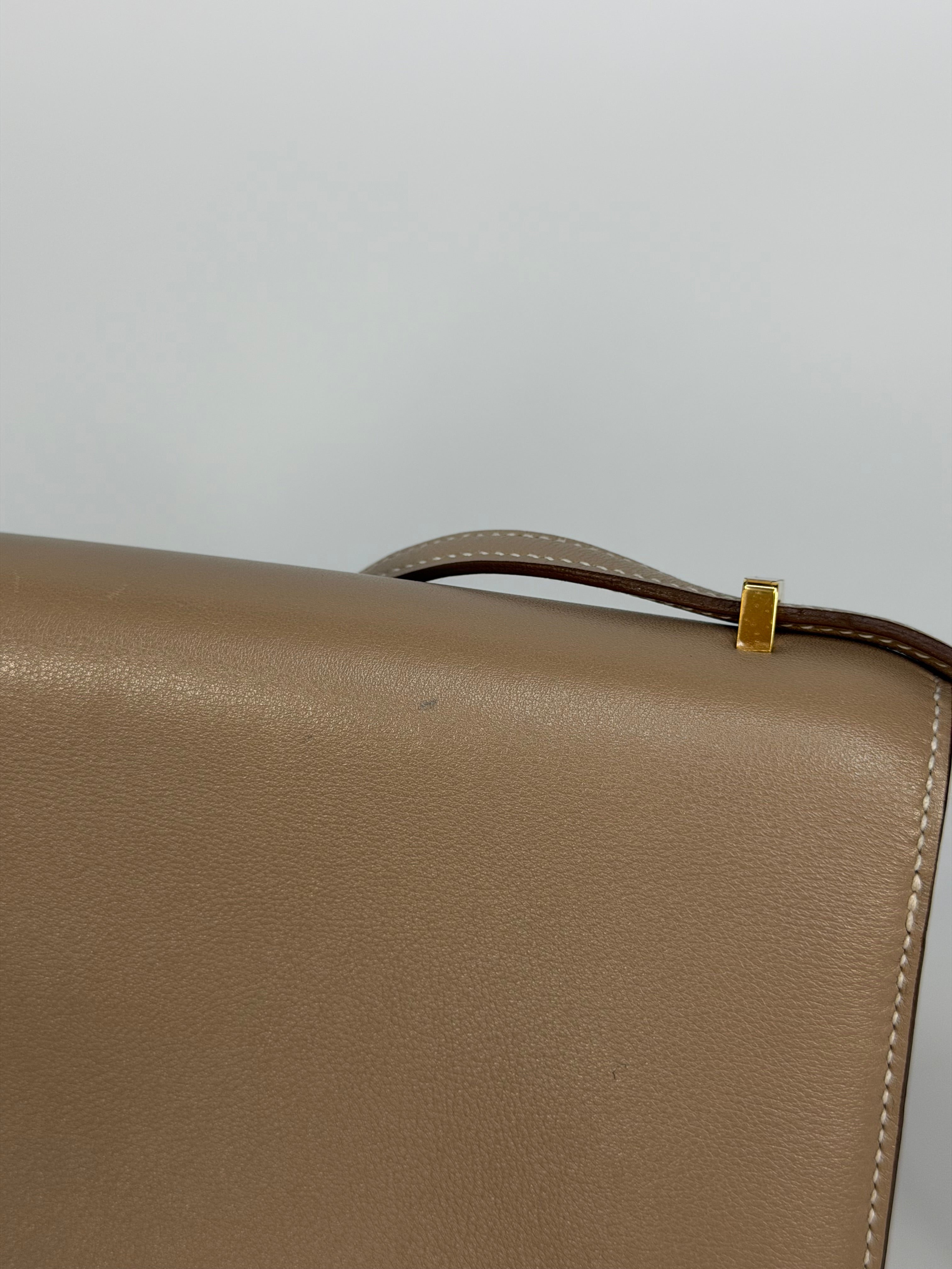 Hermès Constance Elan In Trench Swift Leather With Gold Hardware. Authentic and preloved in very good condition