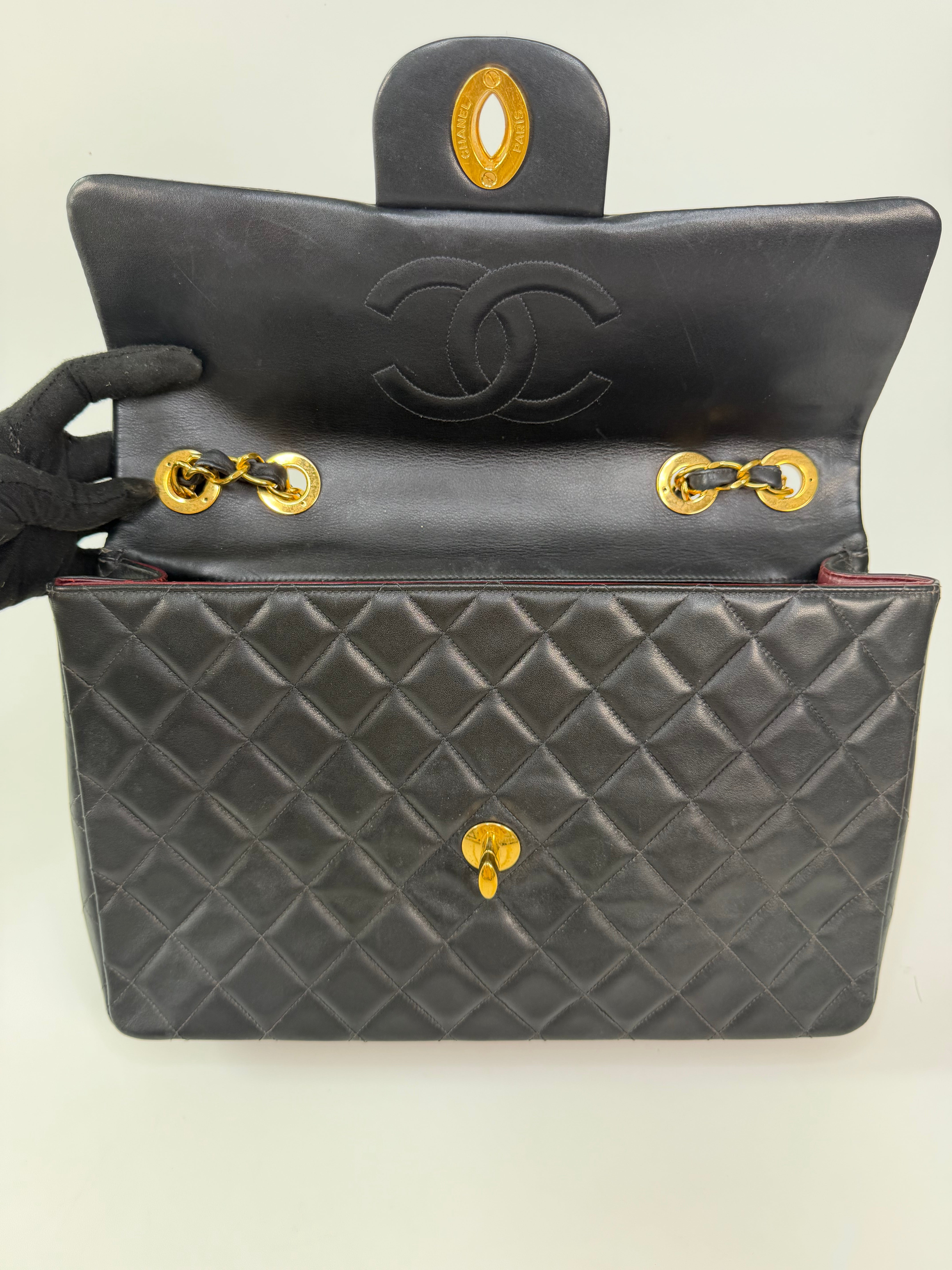 Chanel Vintage XL Maxi Flap Bag In Black Lambskin Gold Hardware. 100% authentic and preloved in excellent condition