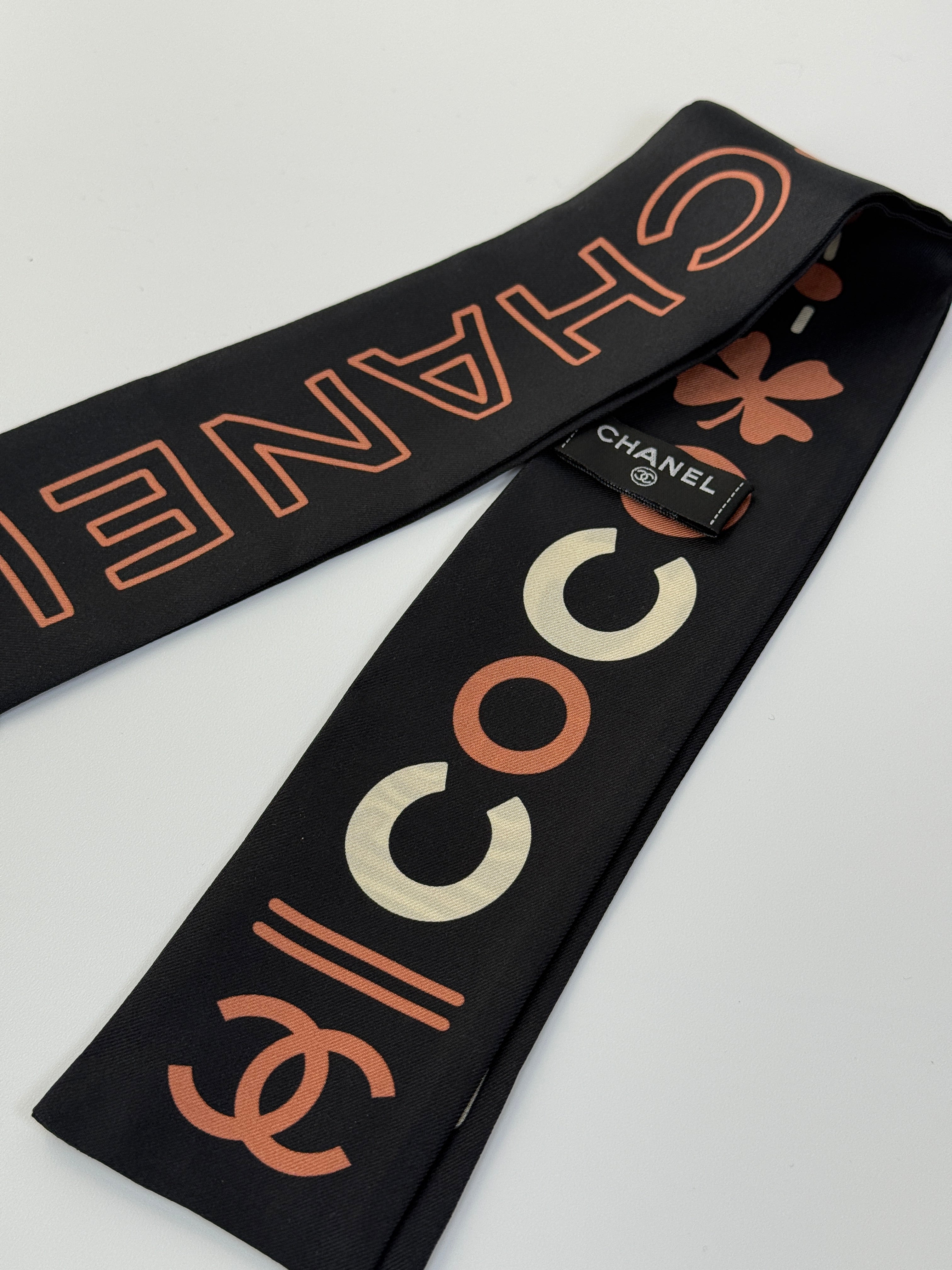 Authentic and preloved Chanel Twilly in black and orange. Excellent condition. 100% Authenticity Guarantee 