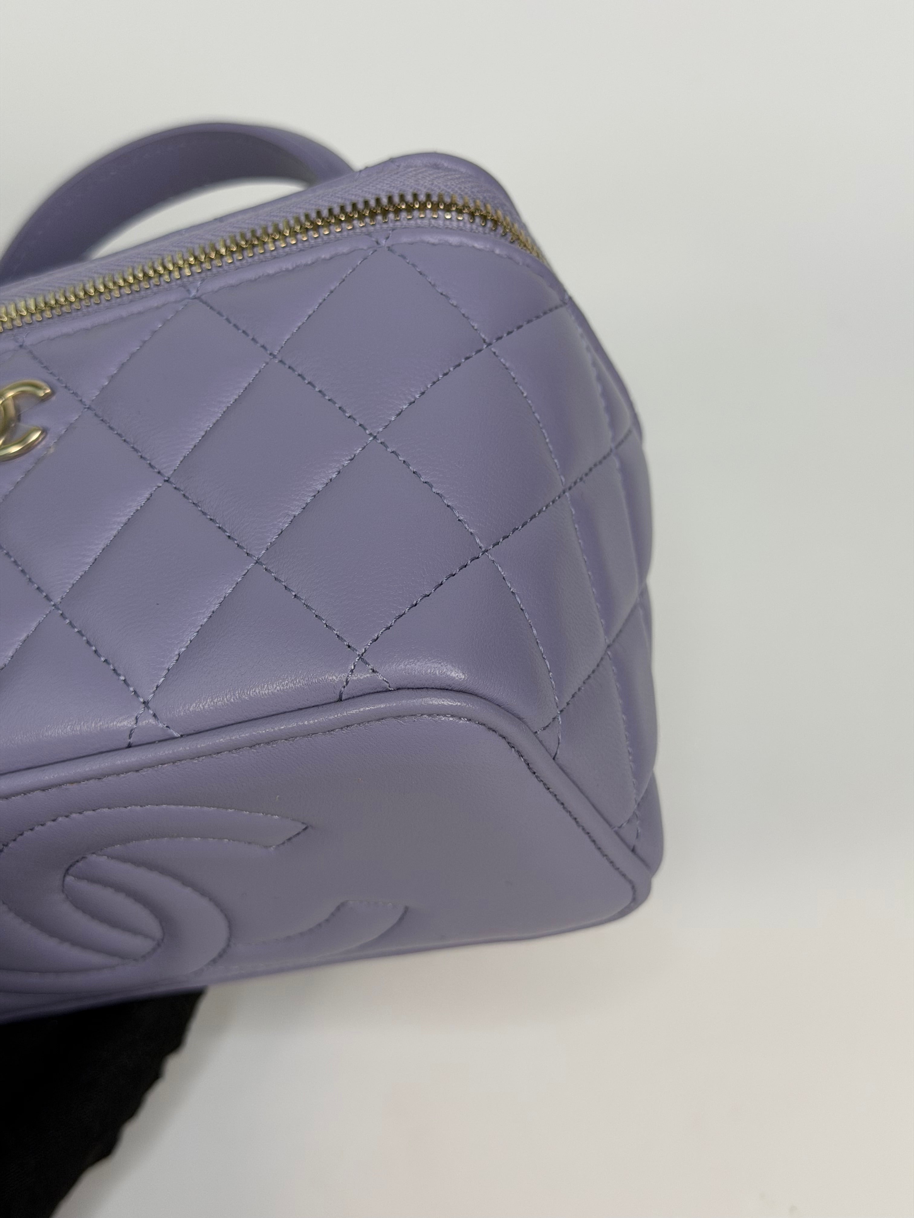 Chanel Mini Vanity Top Handle In Lilac Lambskin Leather With Gold Hardware. Authentic and preloved in excellent condition
