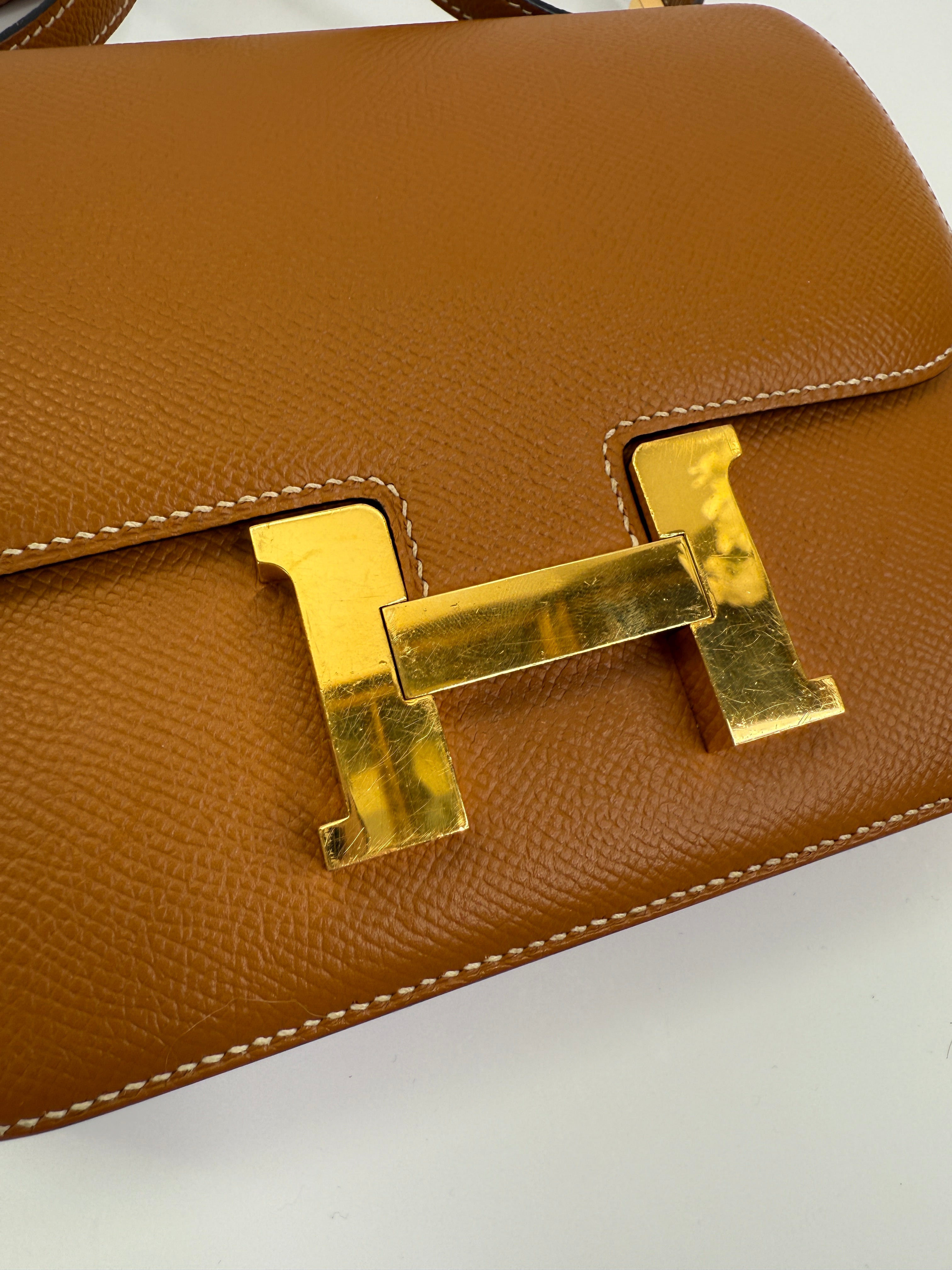 Authentic pre-lovedHermès Constance 18 In Toffee Epsom Leather With Gold Hardware. 