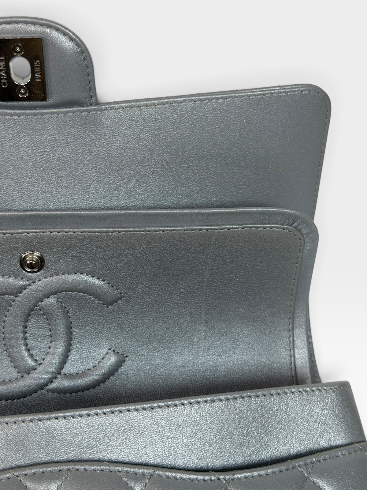 Chanel Medium Classic Double Flap In Silver Lambskin Leather Silver Hardware. 100% authentic and preloved in excellent condition