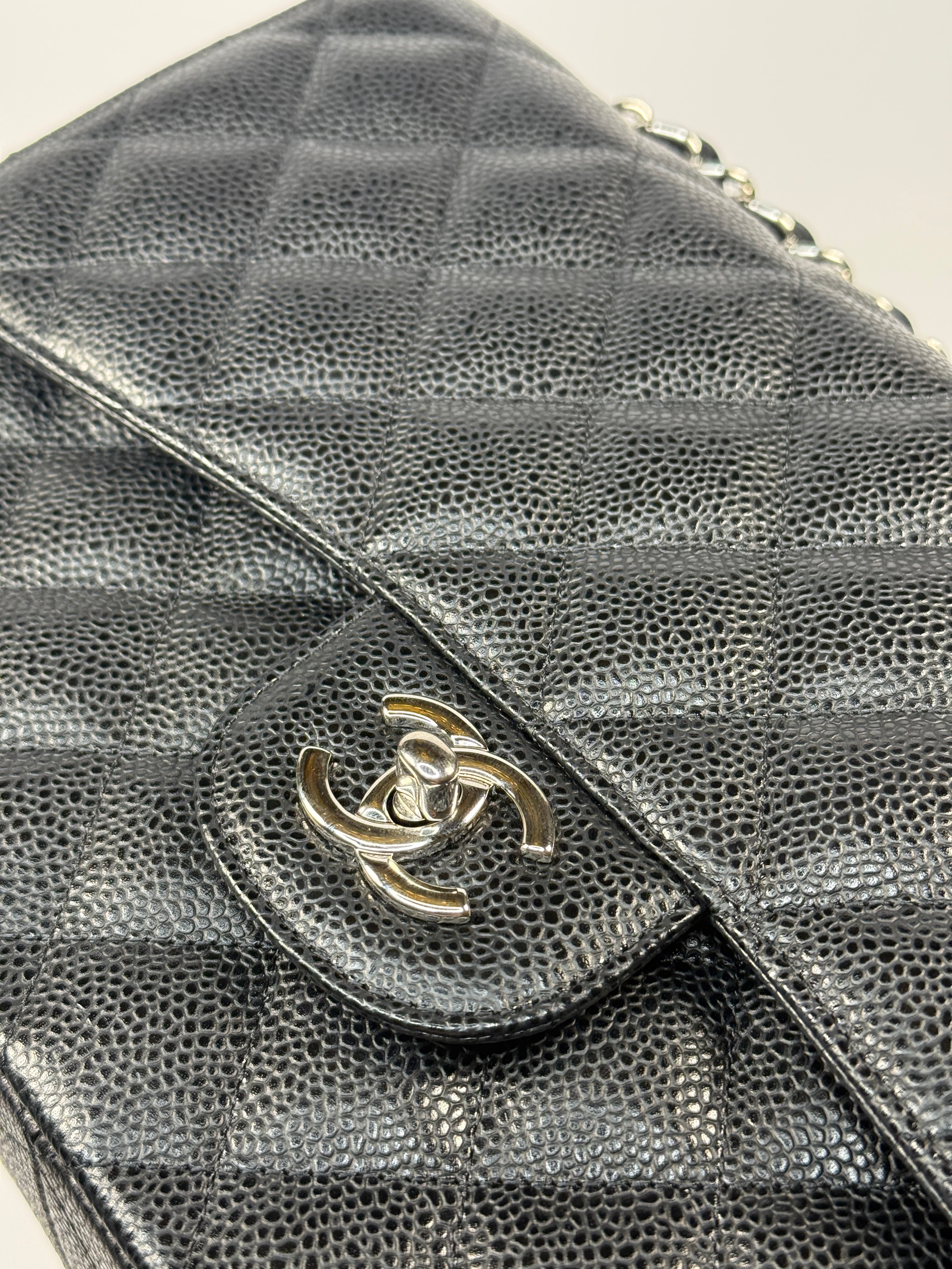 Chanel Classic Jumbo Flap Bag In Black Caviar Leather With Silver Hardware. Authentic and preloved. Excellent condition.