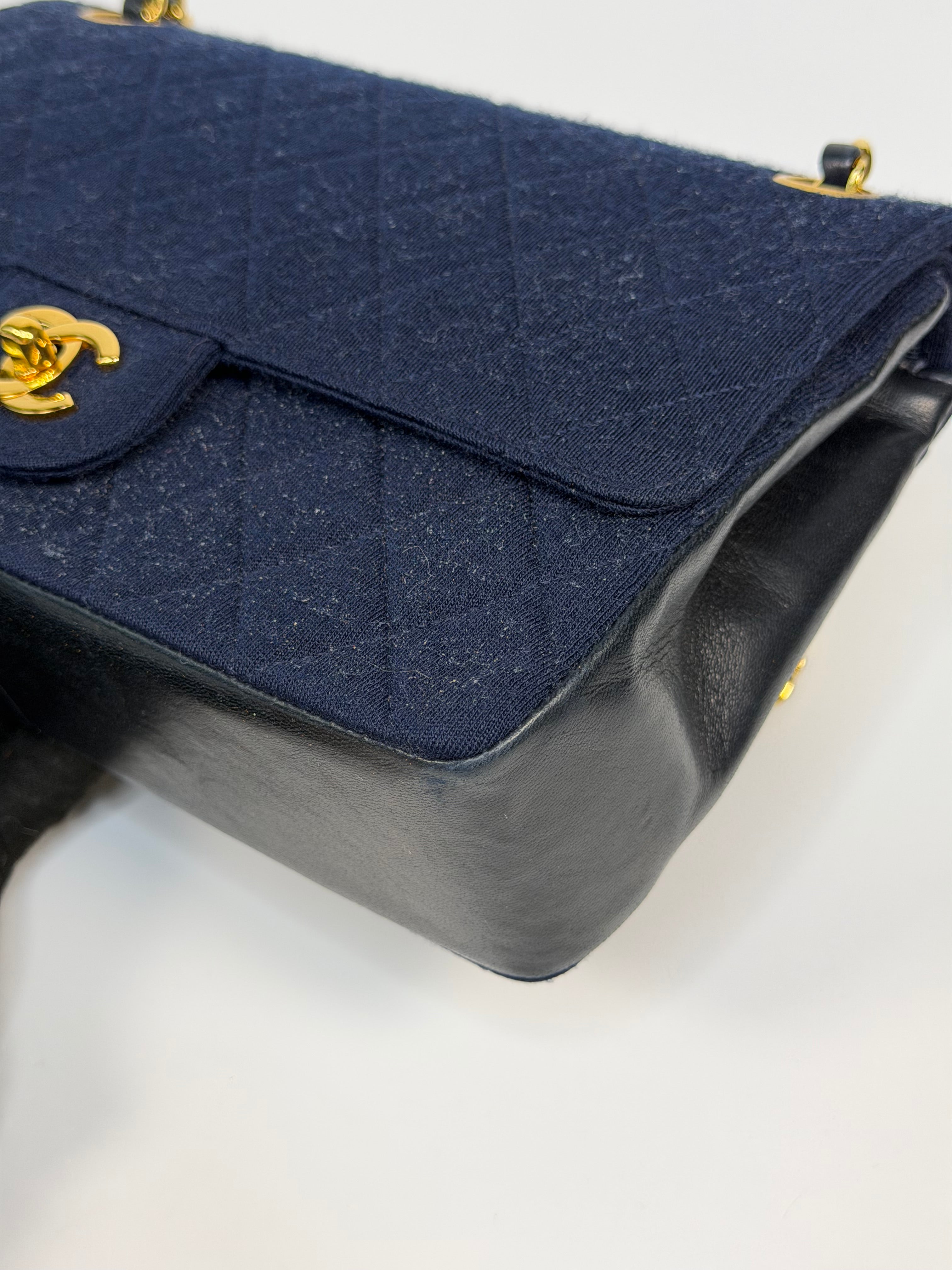 Chanel Vintage Medium Double Flap Navy Cotton With 24Kt Gold Hardware. Authentic and preloved in excellent condition.