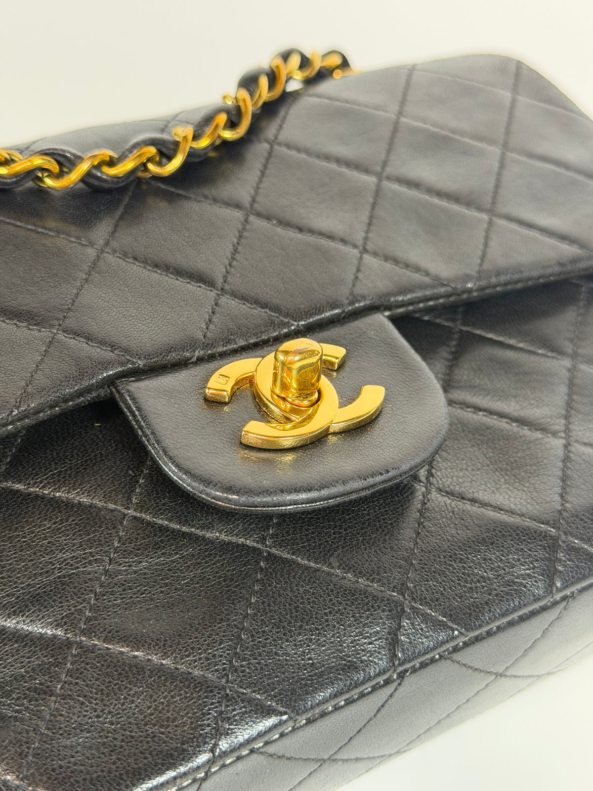 Chanel Vintage Small Classic Double Flap In Black Lambskin Leather 24Kt Hardware. Authentic and preloved in excellent condition. 100% guarantee