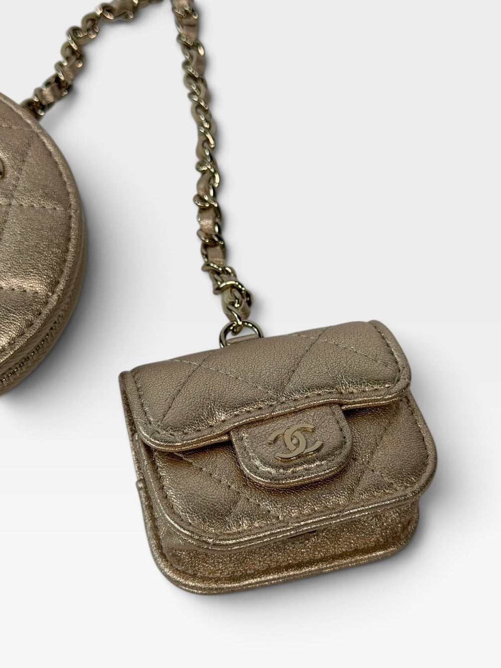 Chanel Round Purse and AirPods Case In Metallic Gold Lambskin. 100% authentic and preloved in excellent condition.