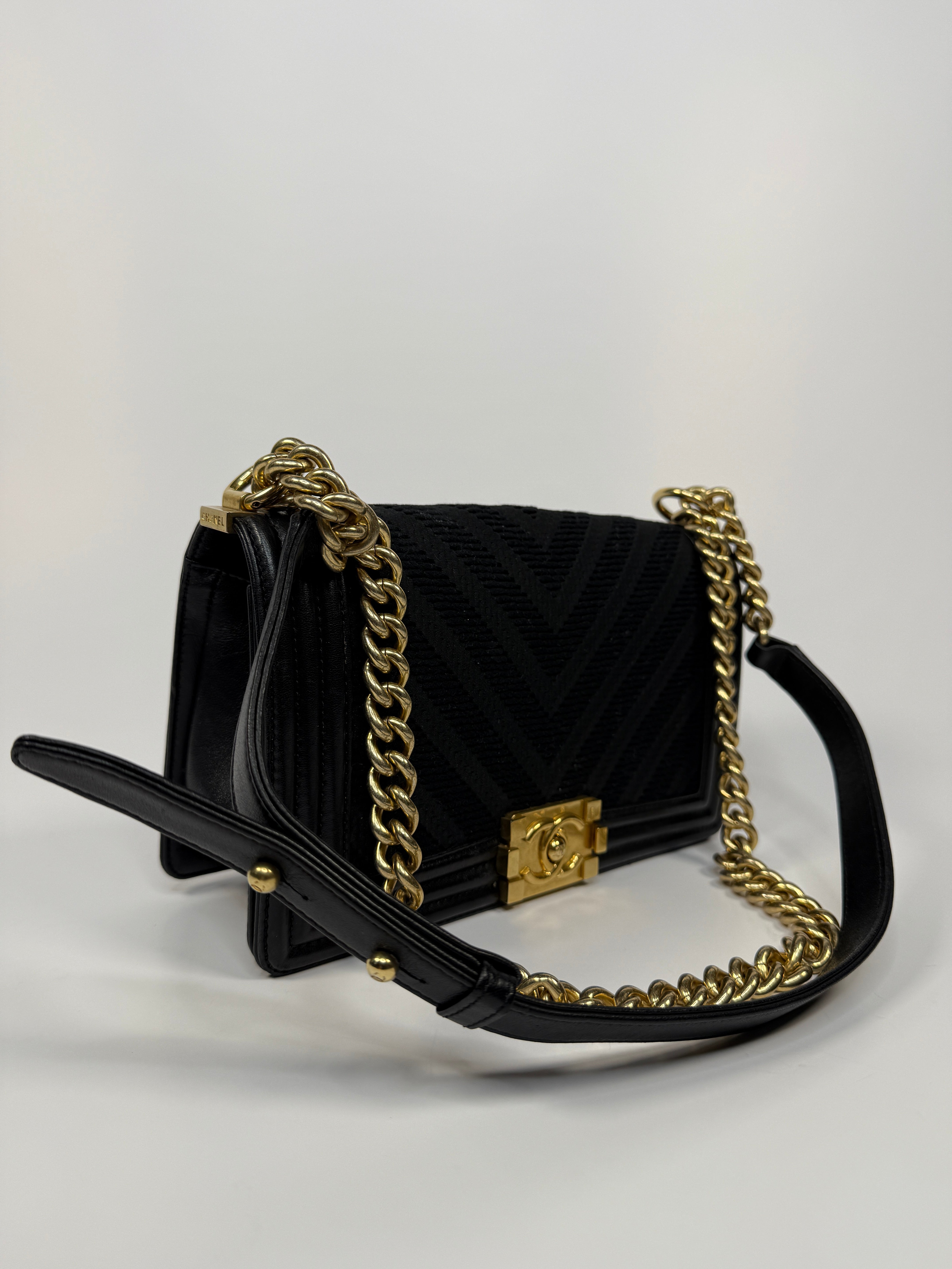 Chanel Black Chevron Fabric & Lambskin Leather Medium Boy Bag With Gold Hardware. Very Good Condition. Authentic and preloved. 