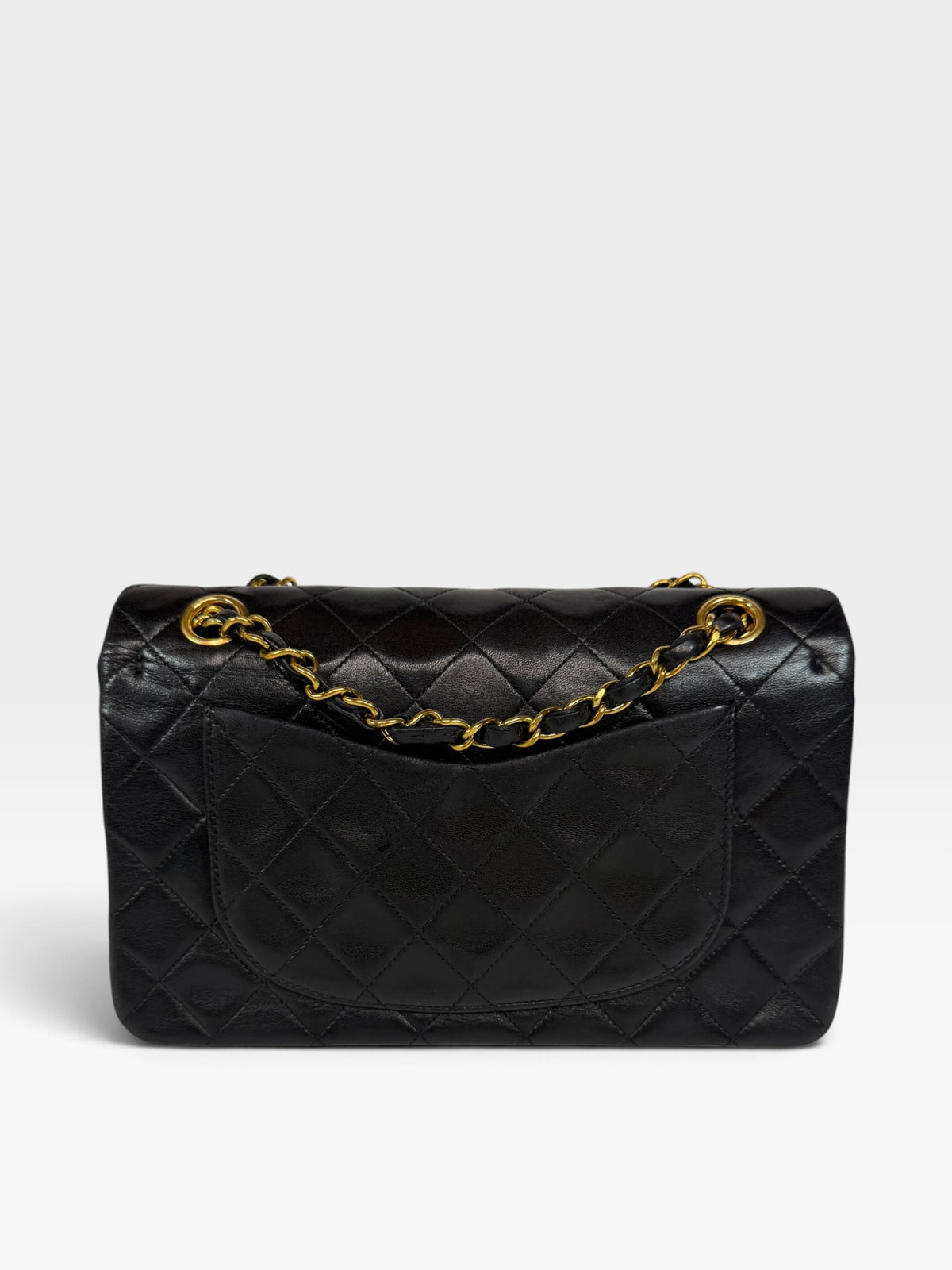 Chanel Vintage Small Classic Double Flap In Black Lambskin Leather 24Kt Hardware. Authentic and preloved in excellent condition. 100% guarantee