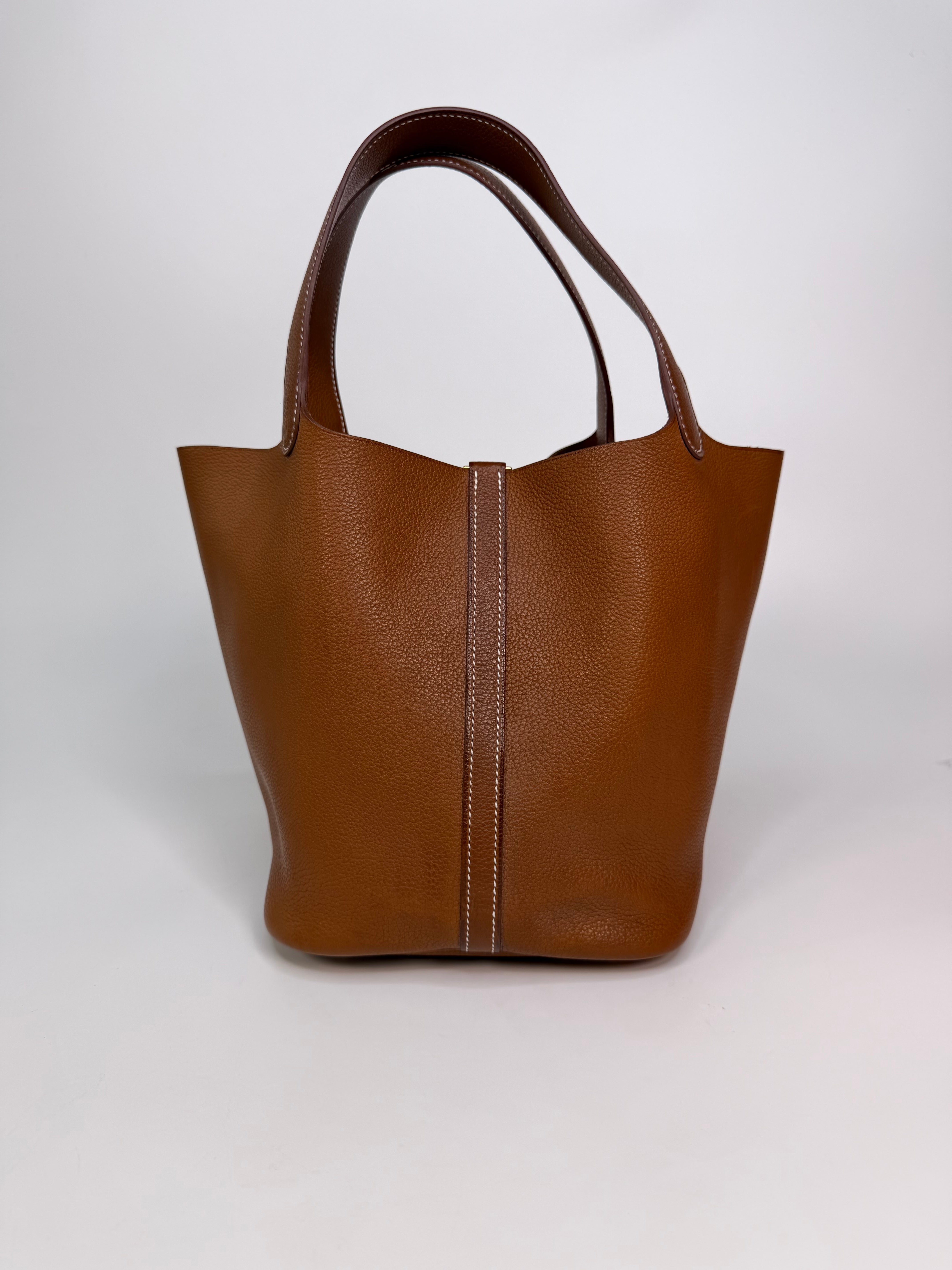 Hermès Picotin 22 In Gold Barenia Fauboug Leather With Gold Hardware. Authentic and preloved in excellent condition