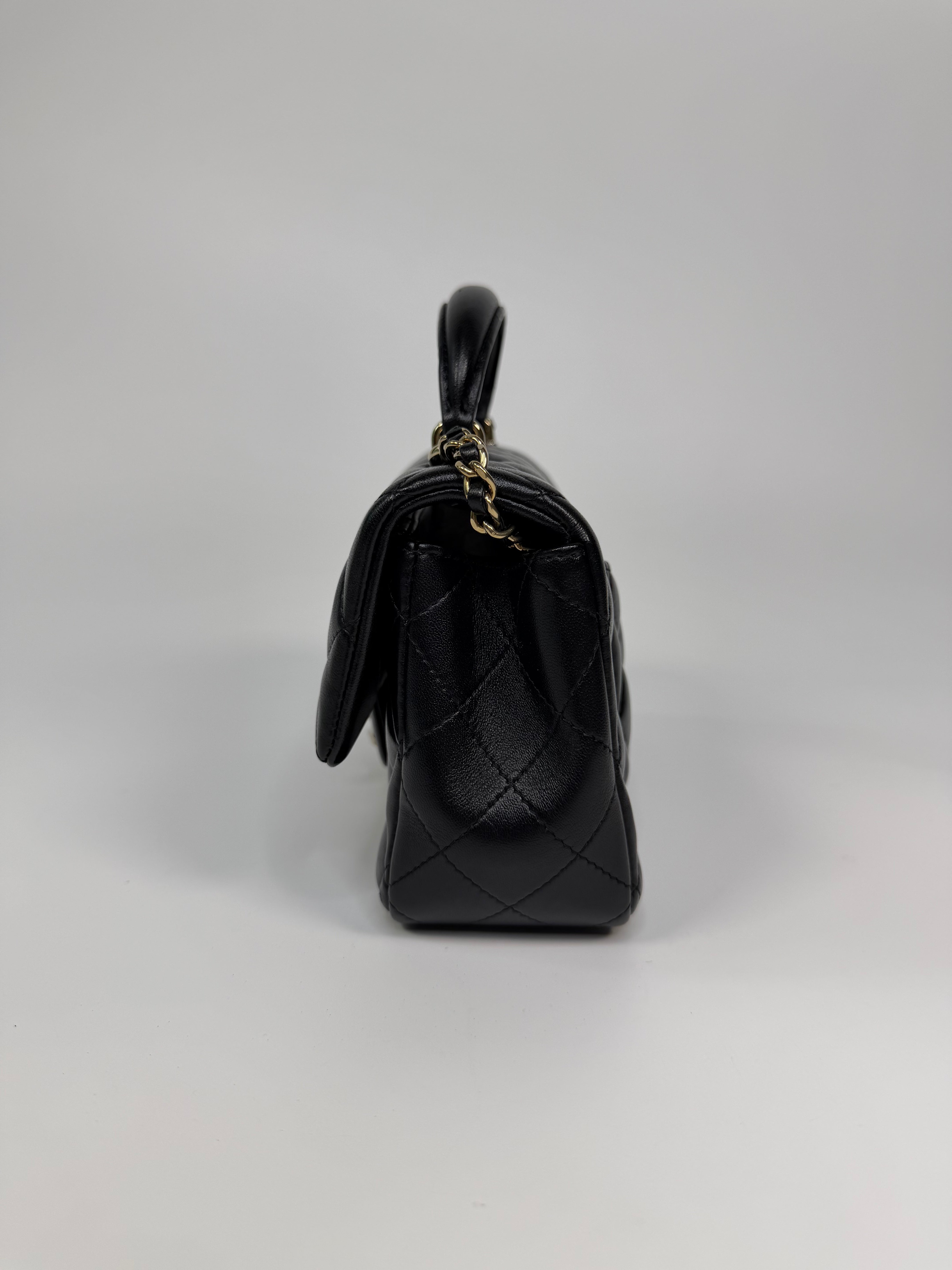 Chanel Mini Rectangle Top Handle In Black Lambskin Leather With Pale Gold Hardware. Authentic and preloved in excellent condition.
