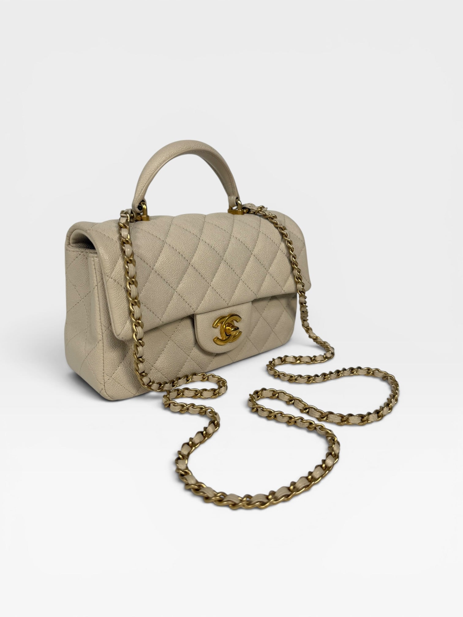 Chanel Mini Rectangle Top Handle In Cream Caviar Leather With Aged Gold Hardware. 100% authentic and preloved in excellent condition.