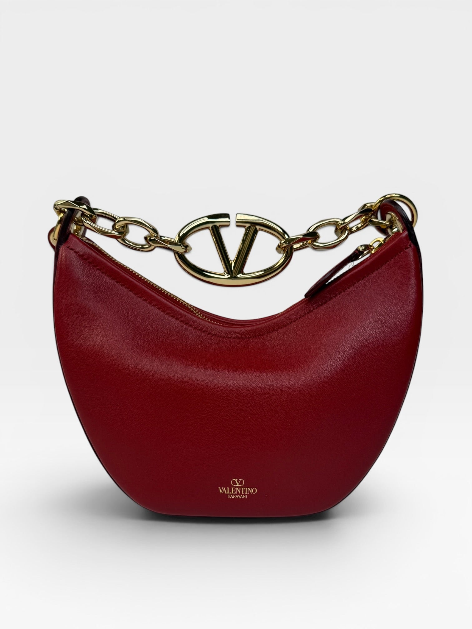 Authentic and preloved Valentino Garavani VLOGO Half Moon Bag  In Red Leather With Gold Hardware 