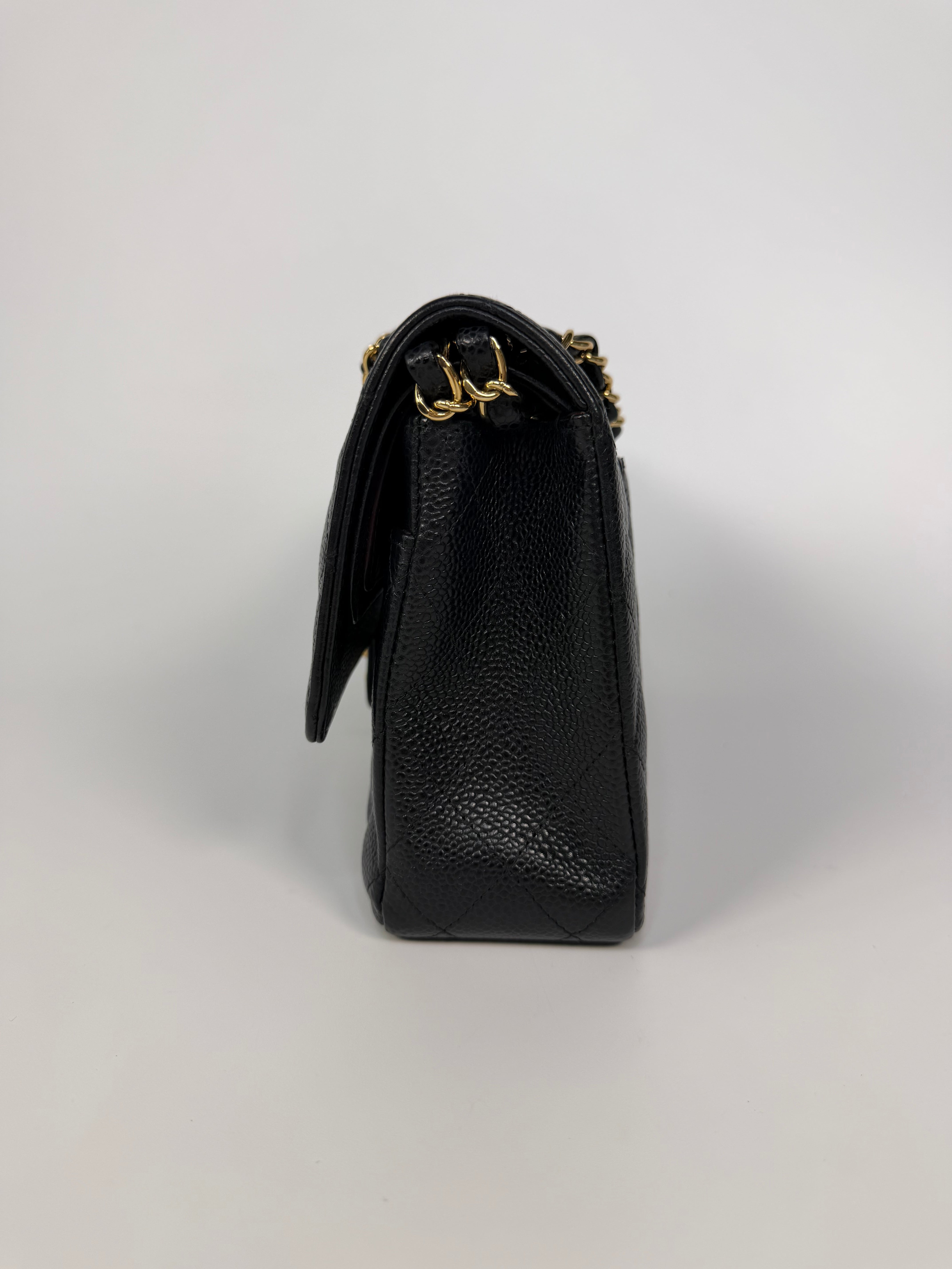 Chanel Medium Classic Double Flap In Black Caviar Leather Gold Hardware. 100% authentic and preloved in excellent condition