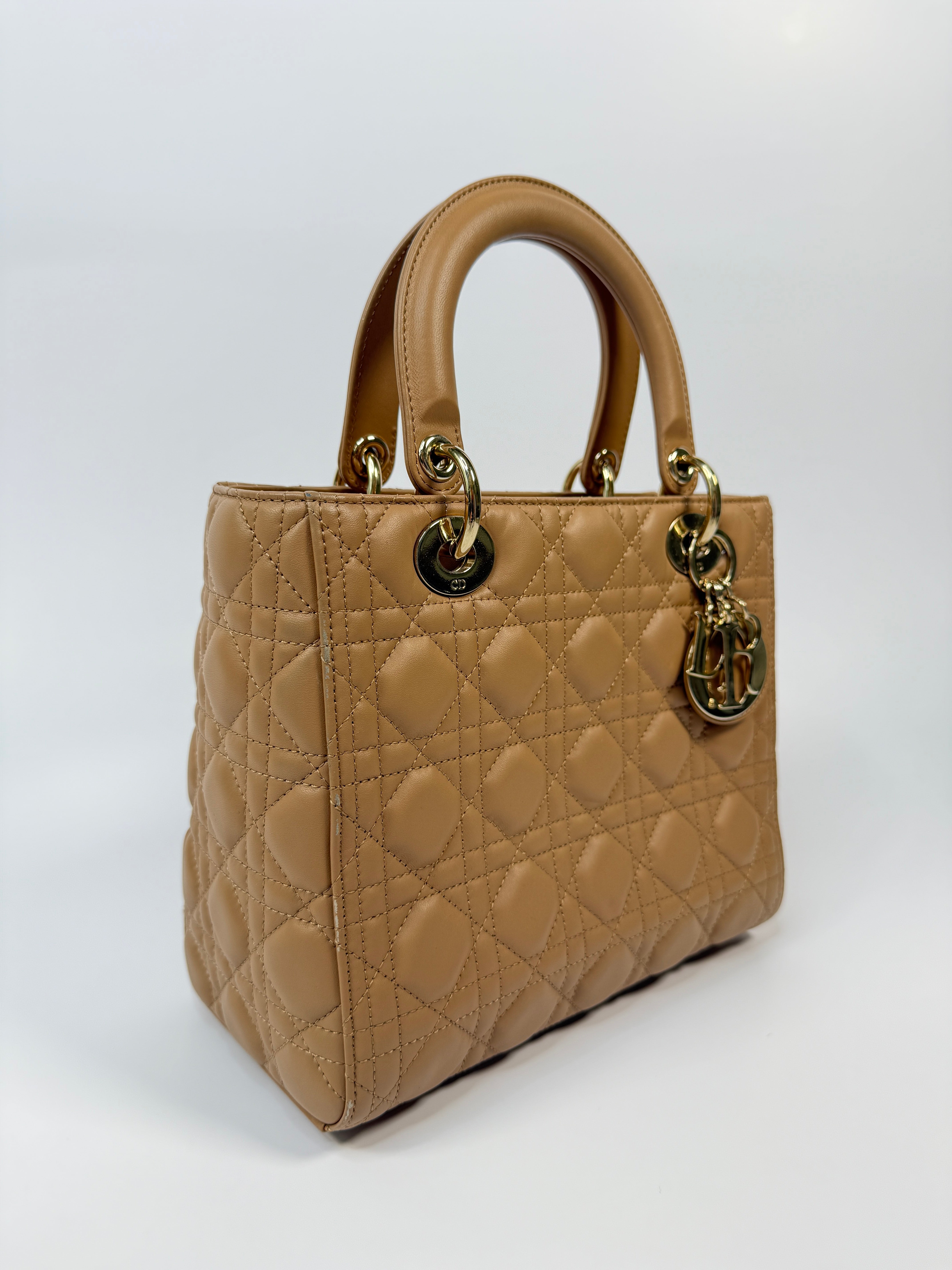 Authentic pre-loved Christian Dior Medium Lady Dior Bag in gold with gold hardware