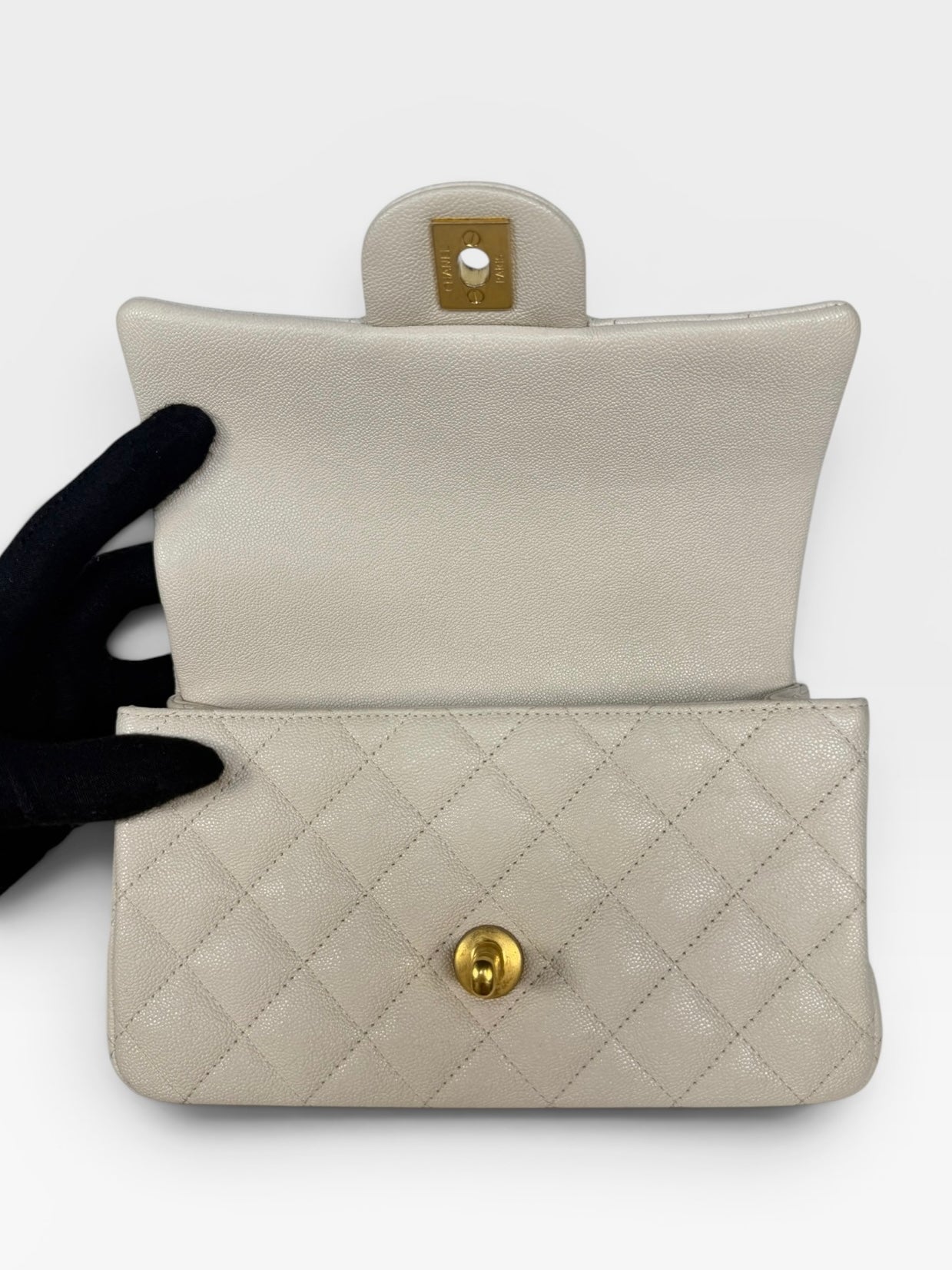 Chanel Mini Rectangle Top Handle In Cream Caviar Leather With Aged Gold Hardware. 100% authentic and preloved in excellent condition.