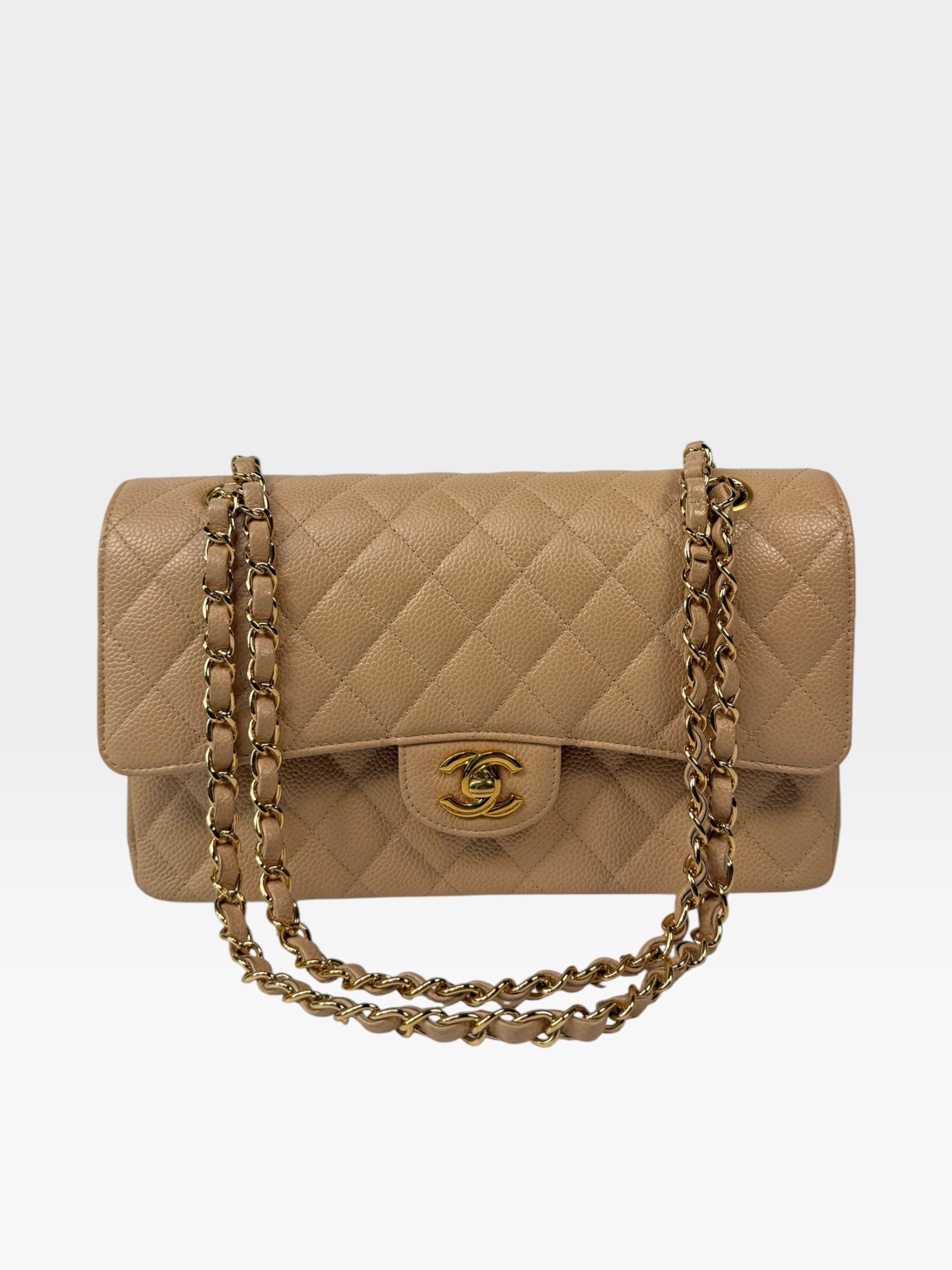 Chanel Medium Classic Flap In Beige Caviar Leather With Gold Hardware. 100% authentic and preloved in excellent condition