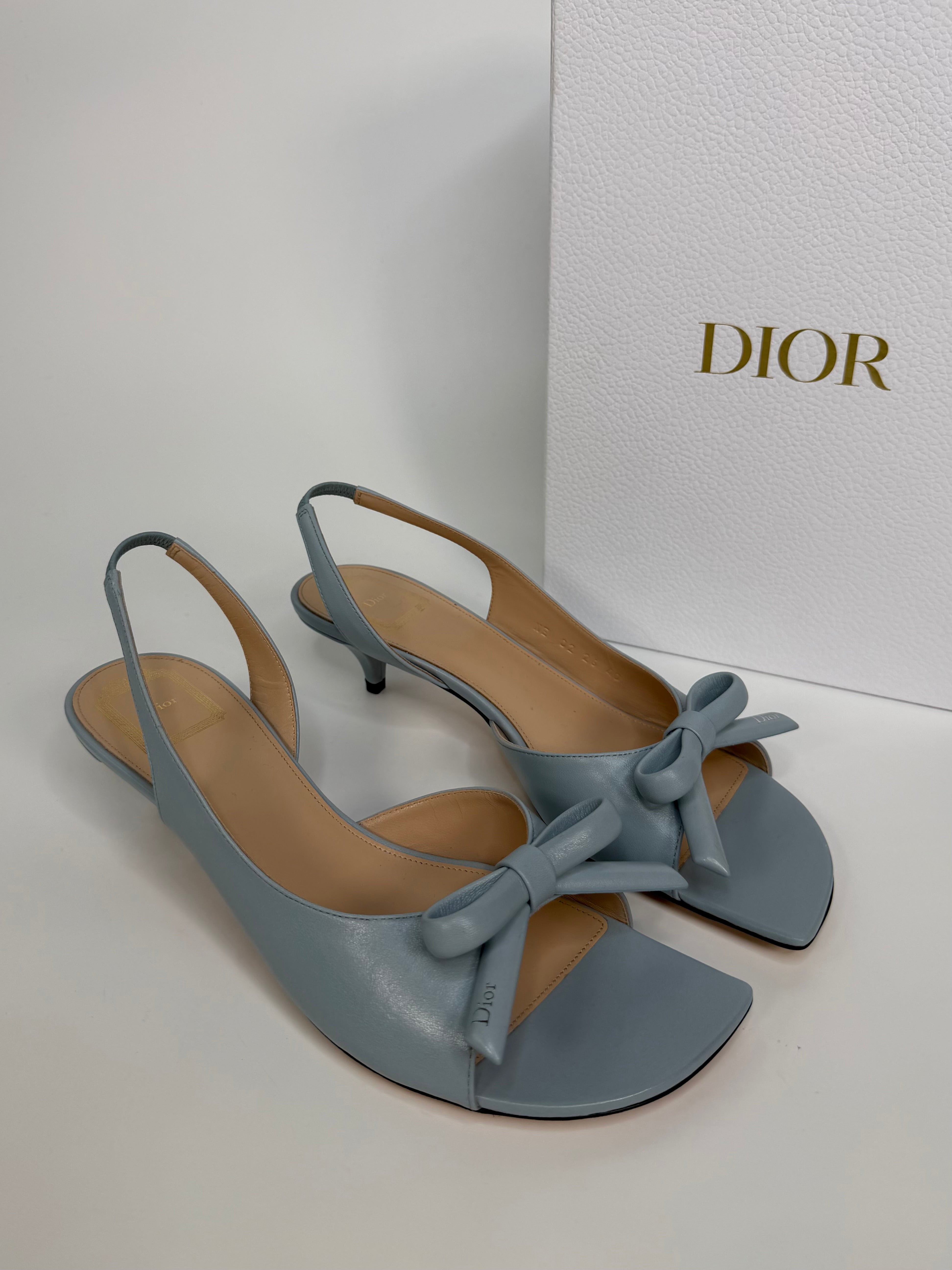 Christian Dior Bow Heeled Slingback Sandals In Blue Lambskin. Authentic and preloved in new and unused condition