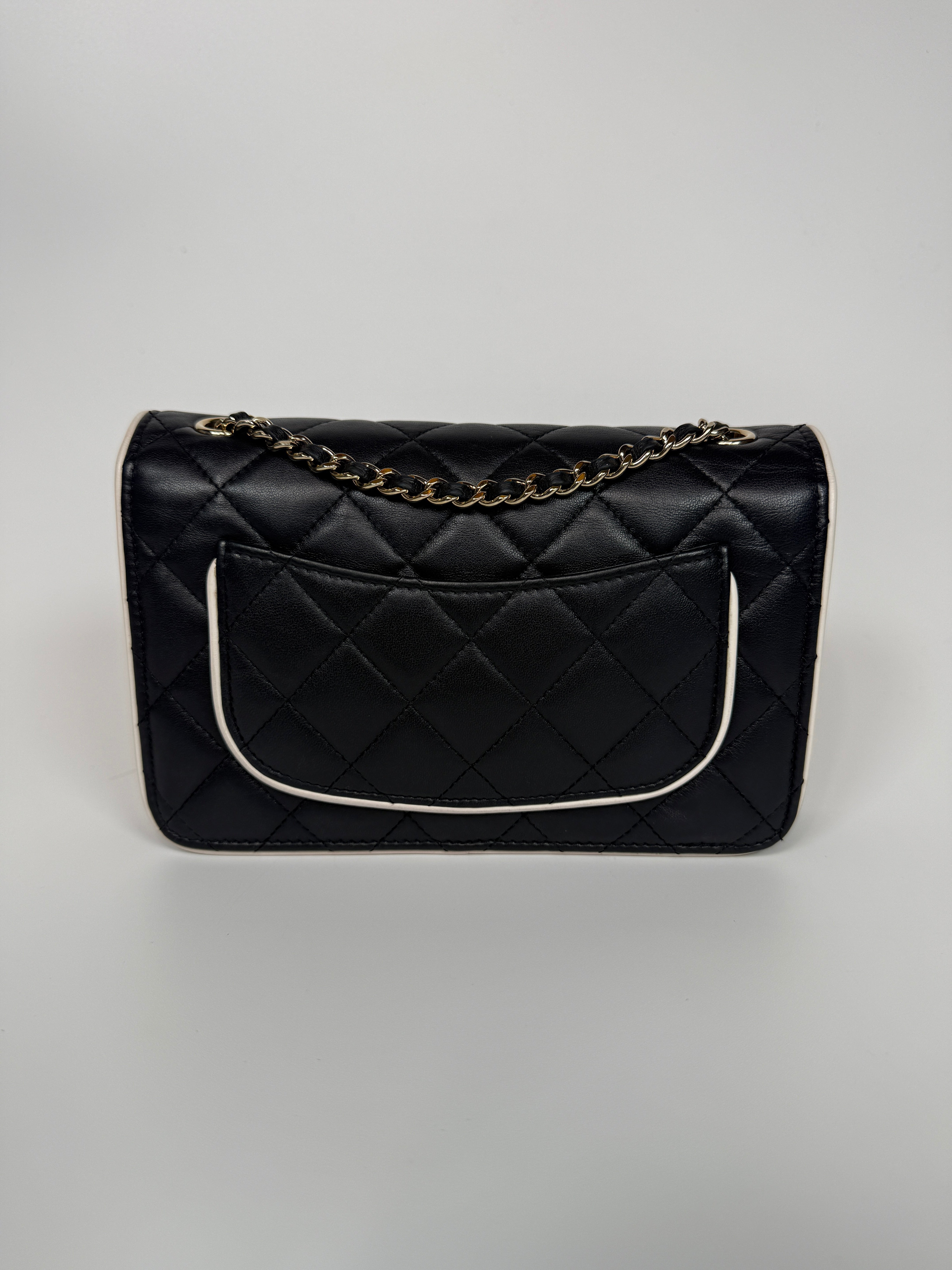 Authentic and preloved Chanel Wallet On Chain In Black & White Lambskin Leather With Pale Gold Hardware. Very Good Condition. 100% Authenticity Guarantee 